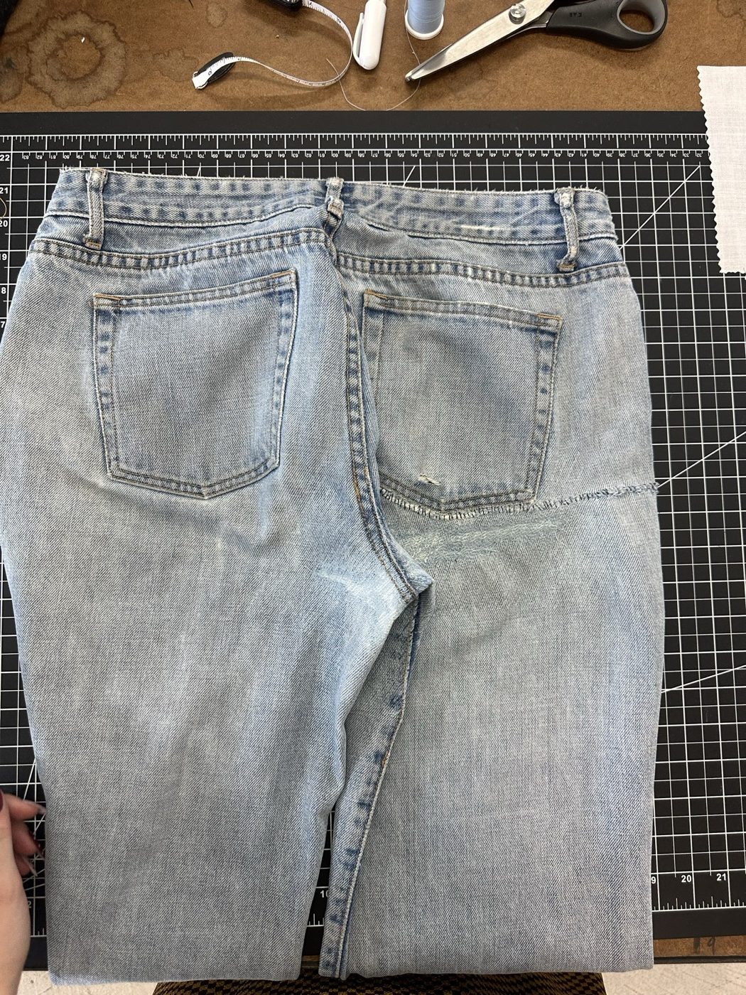 The same jeans after repair, the seat whole again