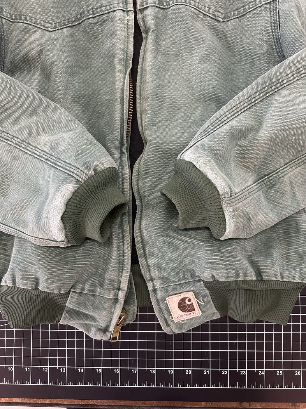 The same jacket with both cuffs repaired