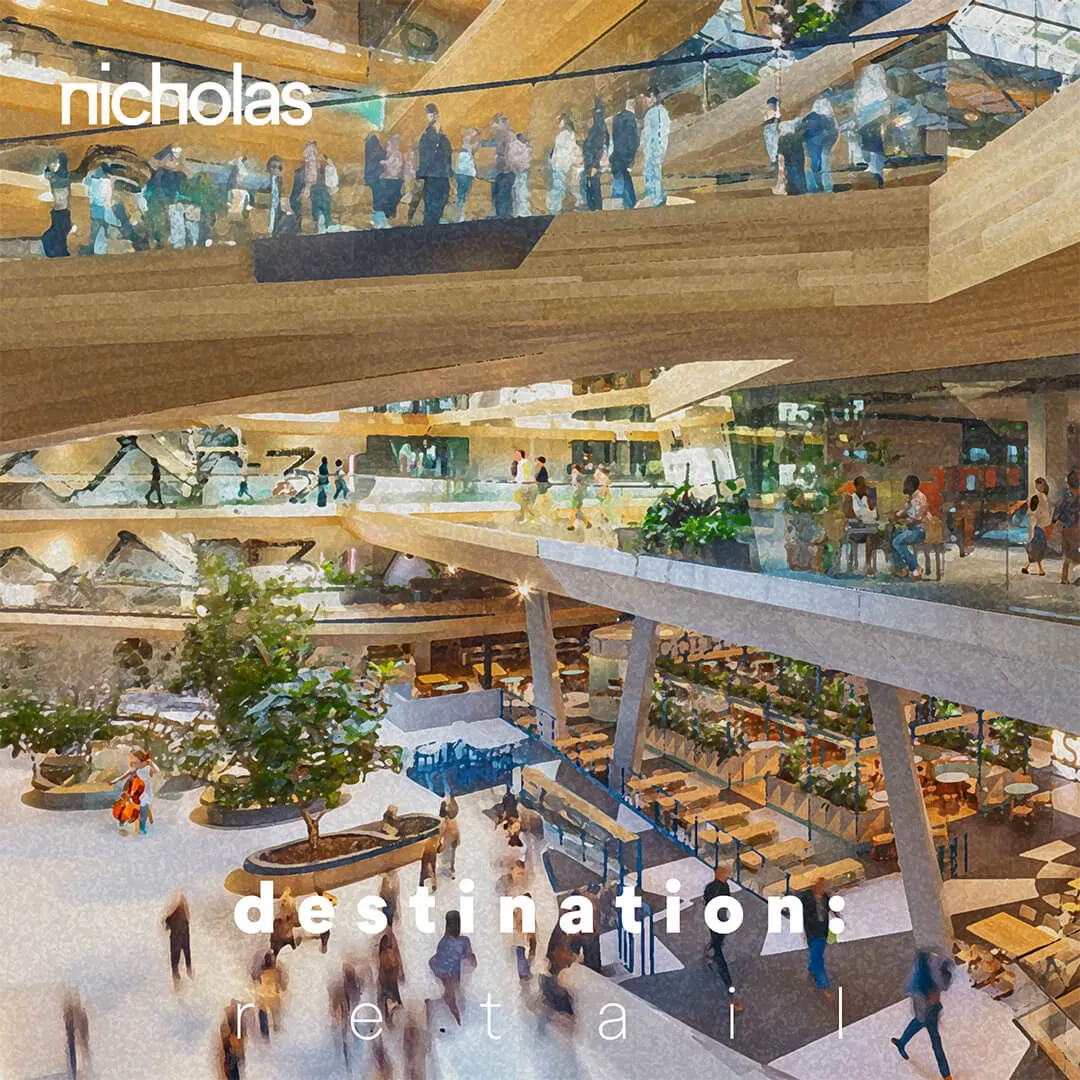Interior of a multi-level shopping mall filled with people, representing retail as a destination that regenerates cities