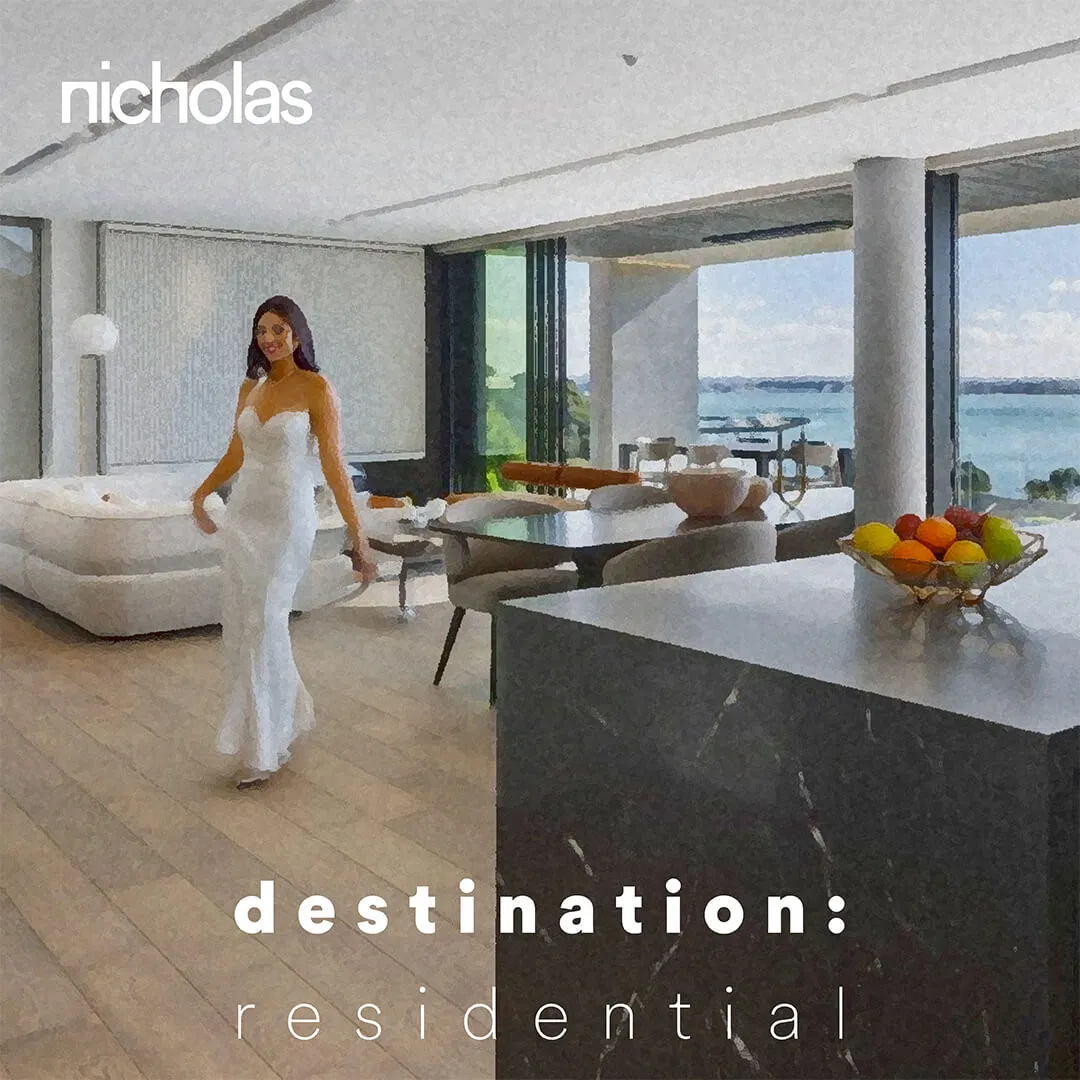 Modern apartment interior with minimalist grey kitchen island and panoramic sea view, symbolizing residential living that blends comfort, luxury and intimacy