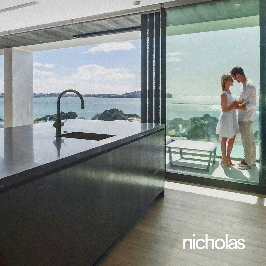 Contemporary residential design featuring a modern grey kitchen island, open-plan living with sea views, and a couple embracing on the terrace, reflecting the essence of luxury residential living as both sanctuary and space for meaningful connection