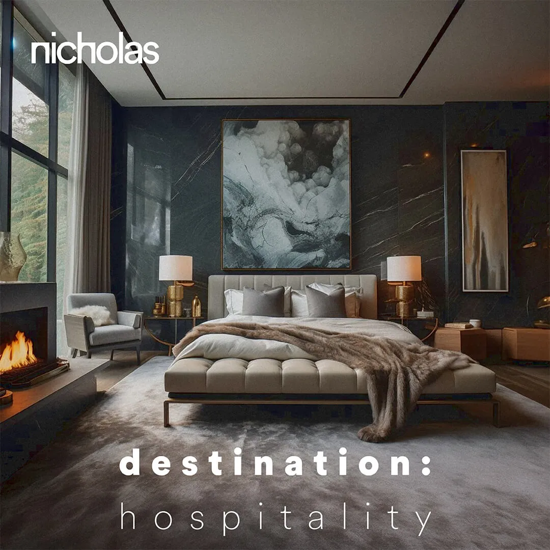 Luxury Hotel Bedroom in dark grey palette with integrated lounge area, custom shelving, and a female guest, representing evocative and well-considered Hospitality Design