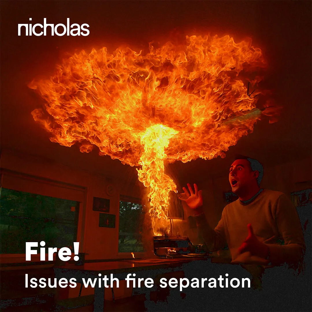 A man facing flames inside a residential interior, highlighting the importance of fire separation