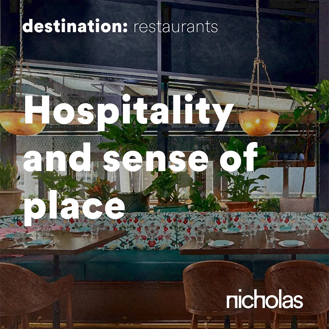 Restaurant with shared tables and social spaces acting as the heart of a mixed-use urban development