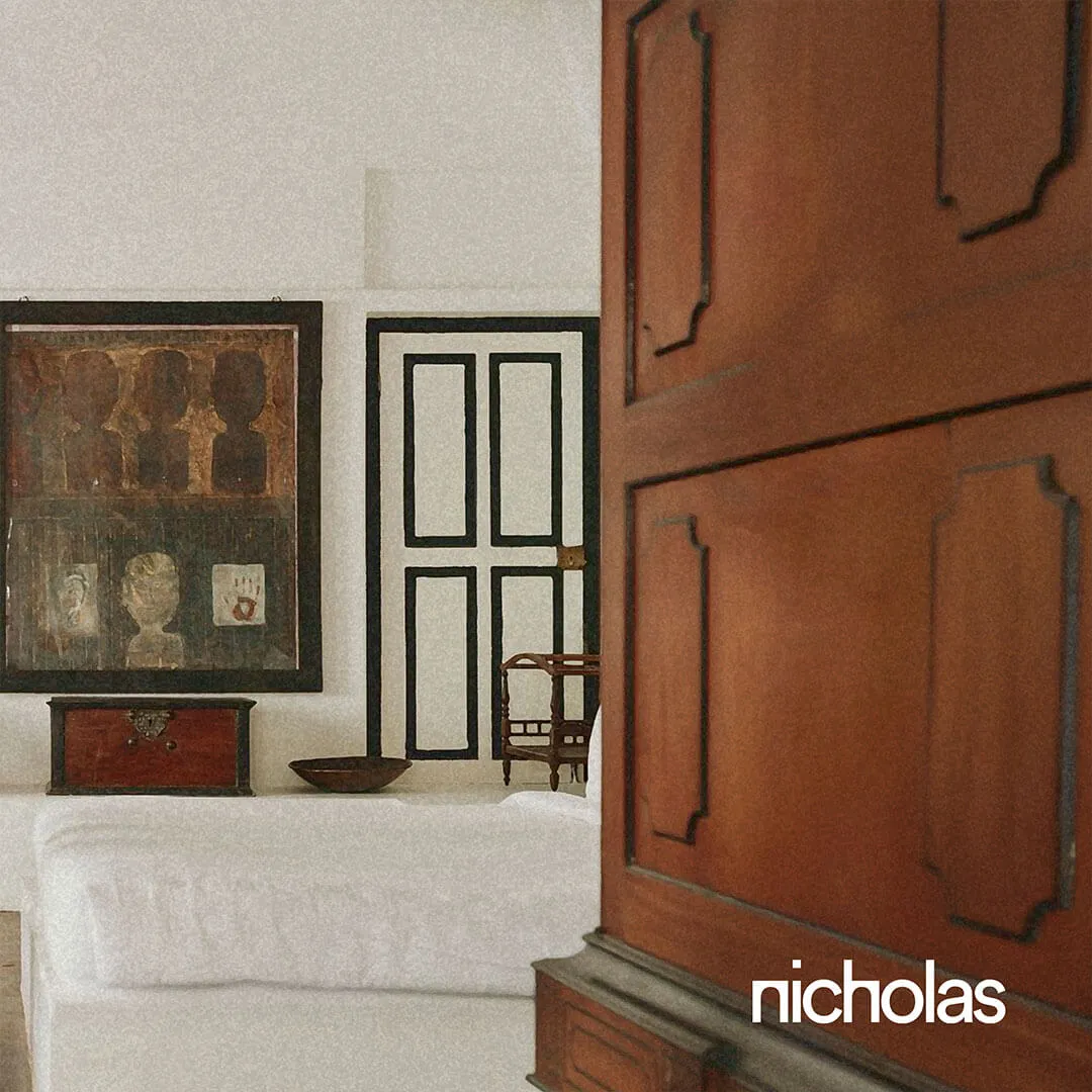 Resort architecture integrated into the natural landscape, blending local materials, greenery and traditional elements