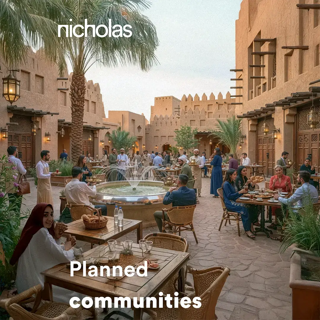 Vibrant pedestrian street with cafés and people socialising, illustrating human-centred urban design and the role of streets as social hubs in well-planned communities