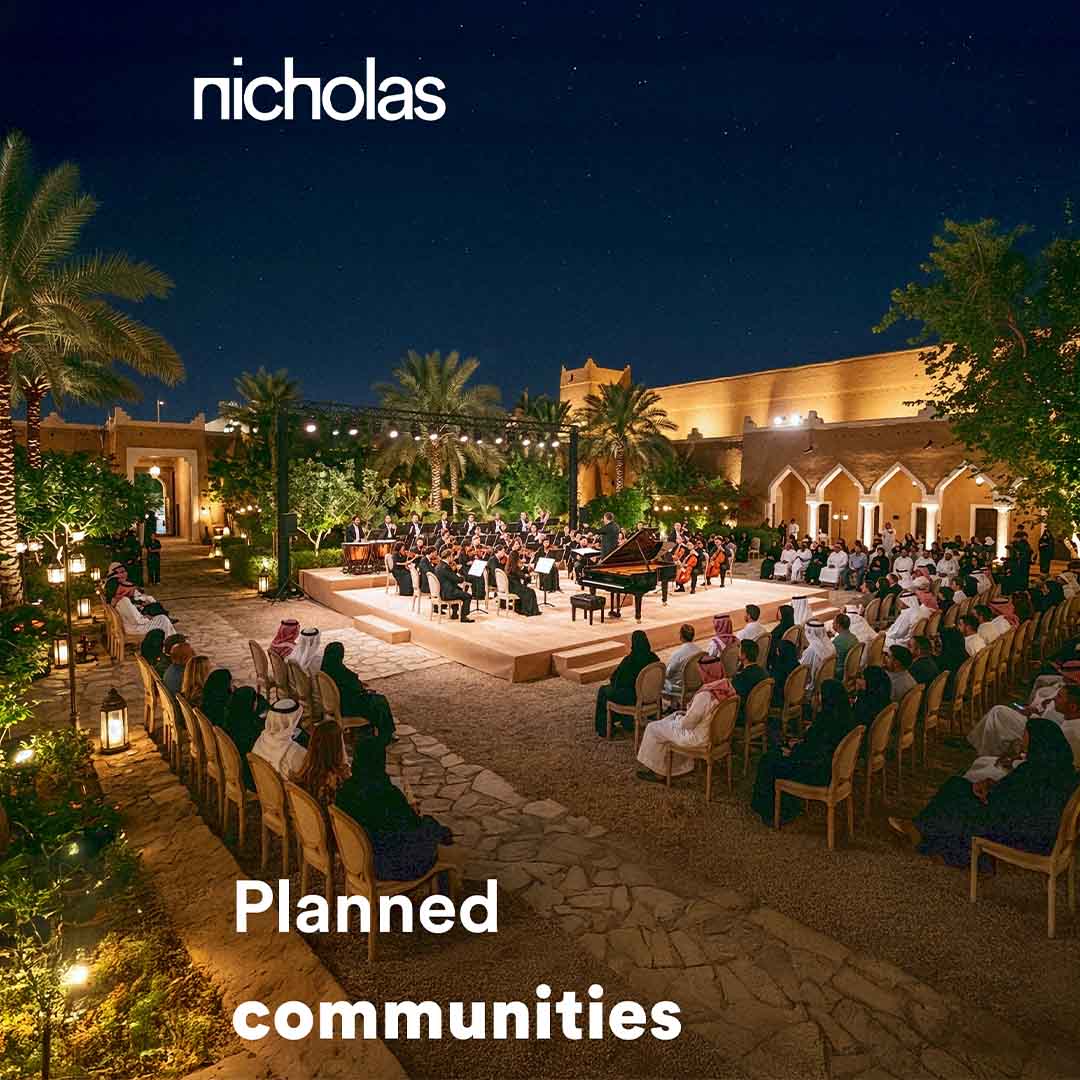 Elegant community event held within a landscaped courtyard, where guests gather to enjoy a live orchestra performance, illustrating vibrant public spaces inspired by Middle Eastern architecture