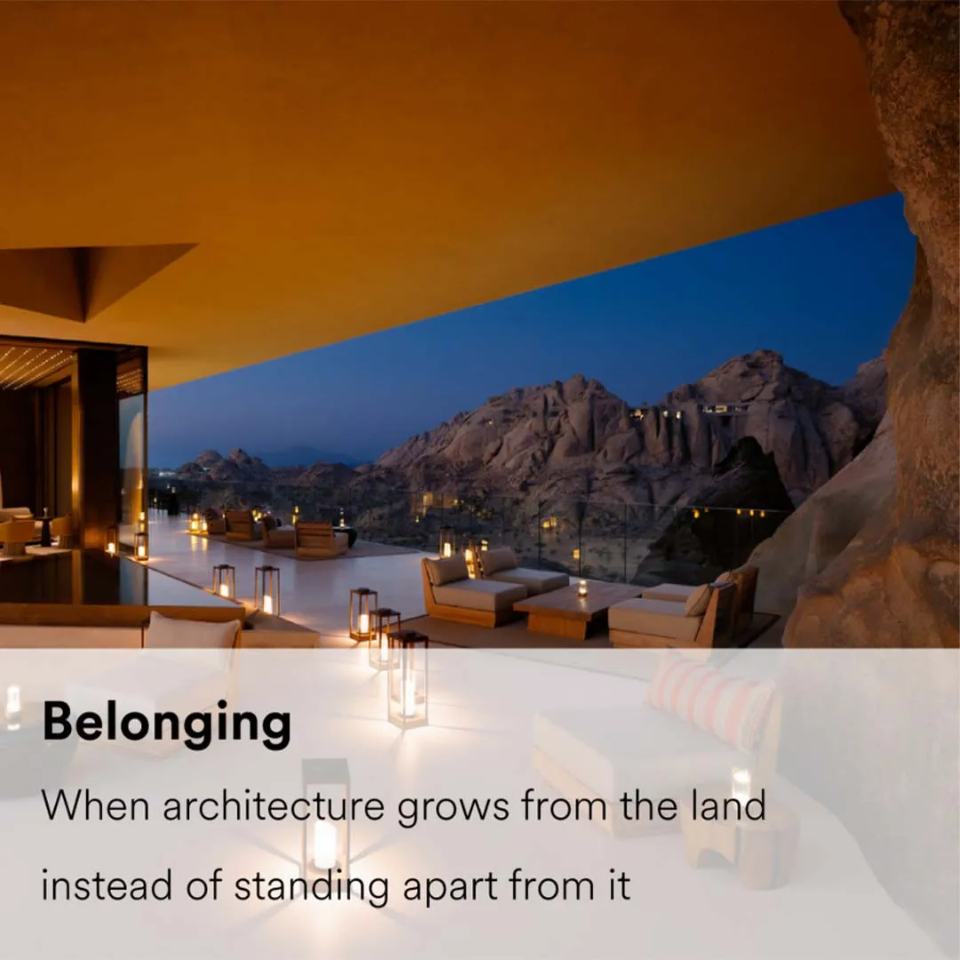 A luxury resort architecture integrated into a rugged rocky landscape, expressing harmony between built form and geology