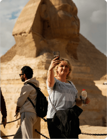 A tourist lady taking a selfie picture with The Sphinx   