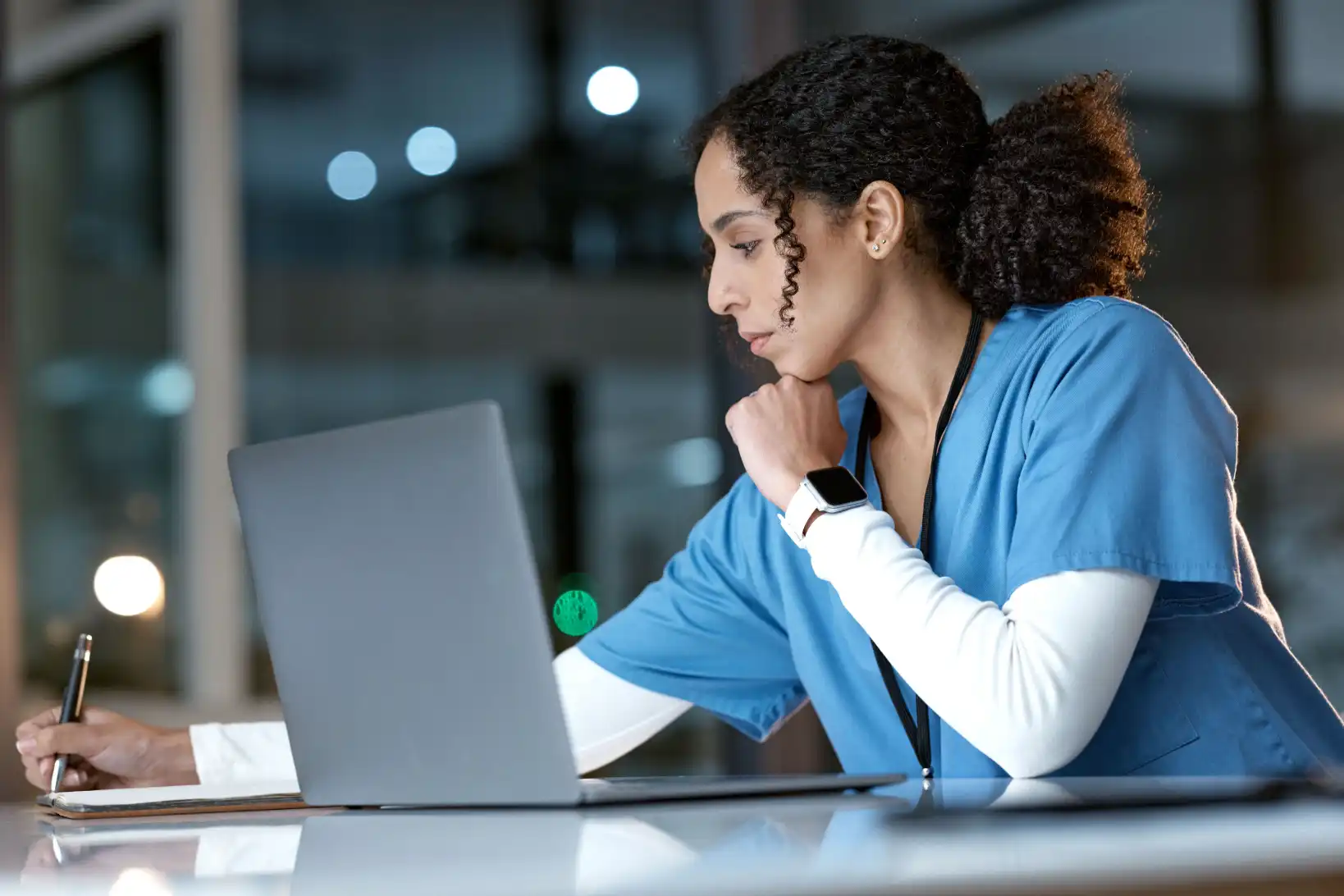 Female nurse working to improve nursing prerequisite scores online