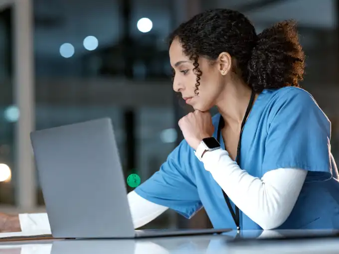 Female nurse working to improve nursing prerequisite scores online