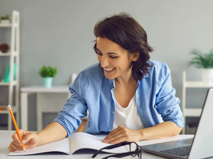 Woman working to learn online on a laptop from home