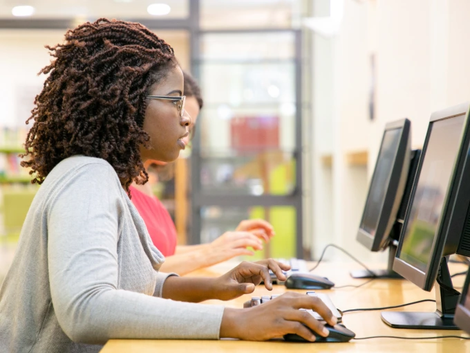 African American female taking her NCLEX in a testing center