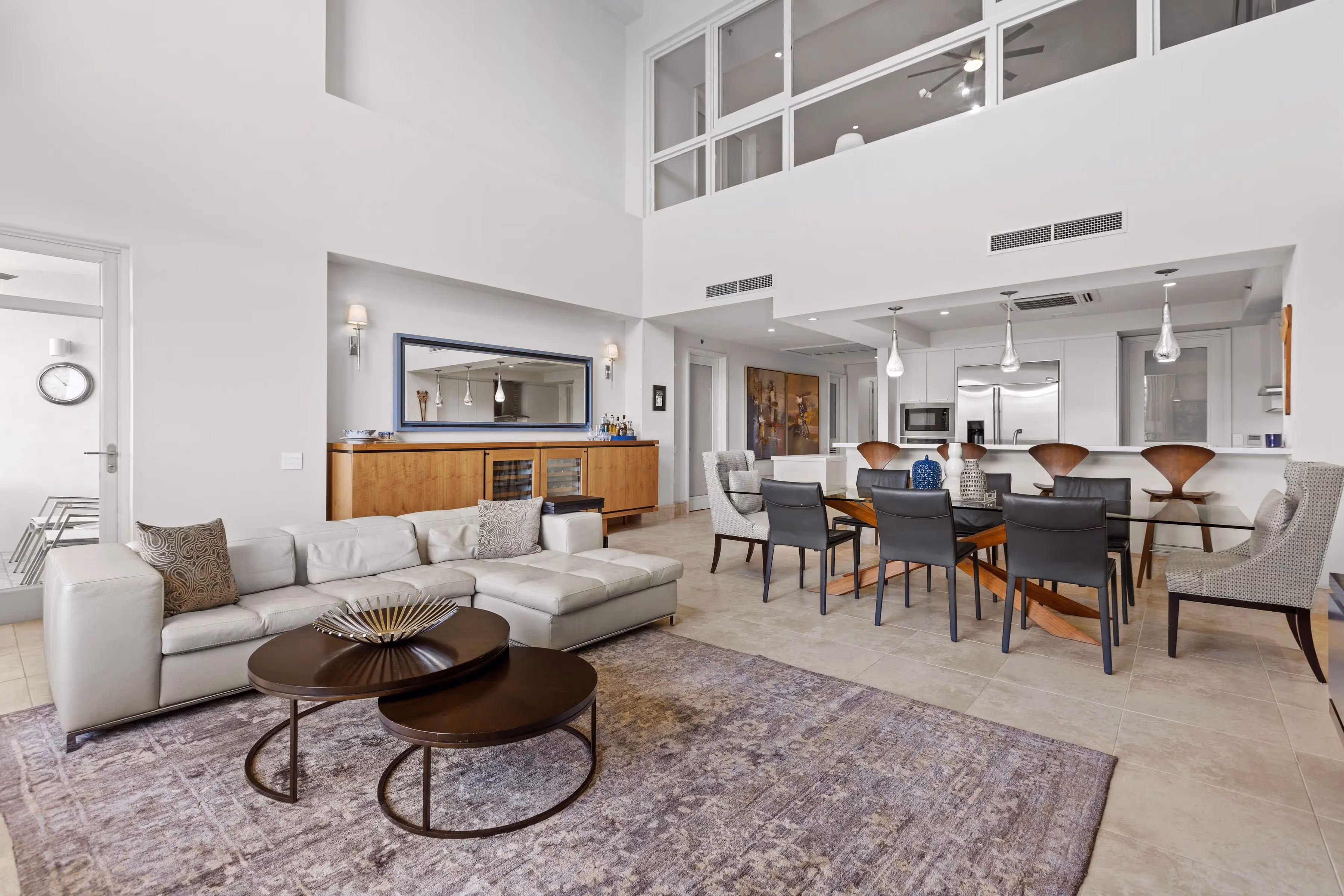 Secondary living space with bar and balcony on second floor