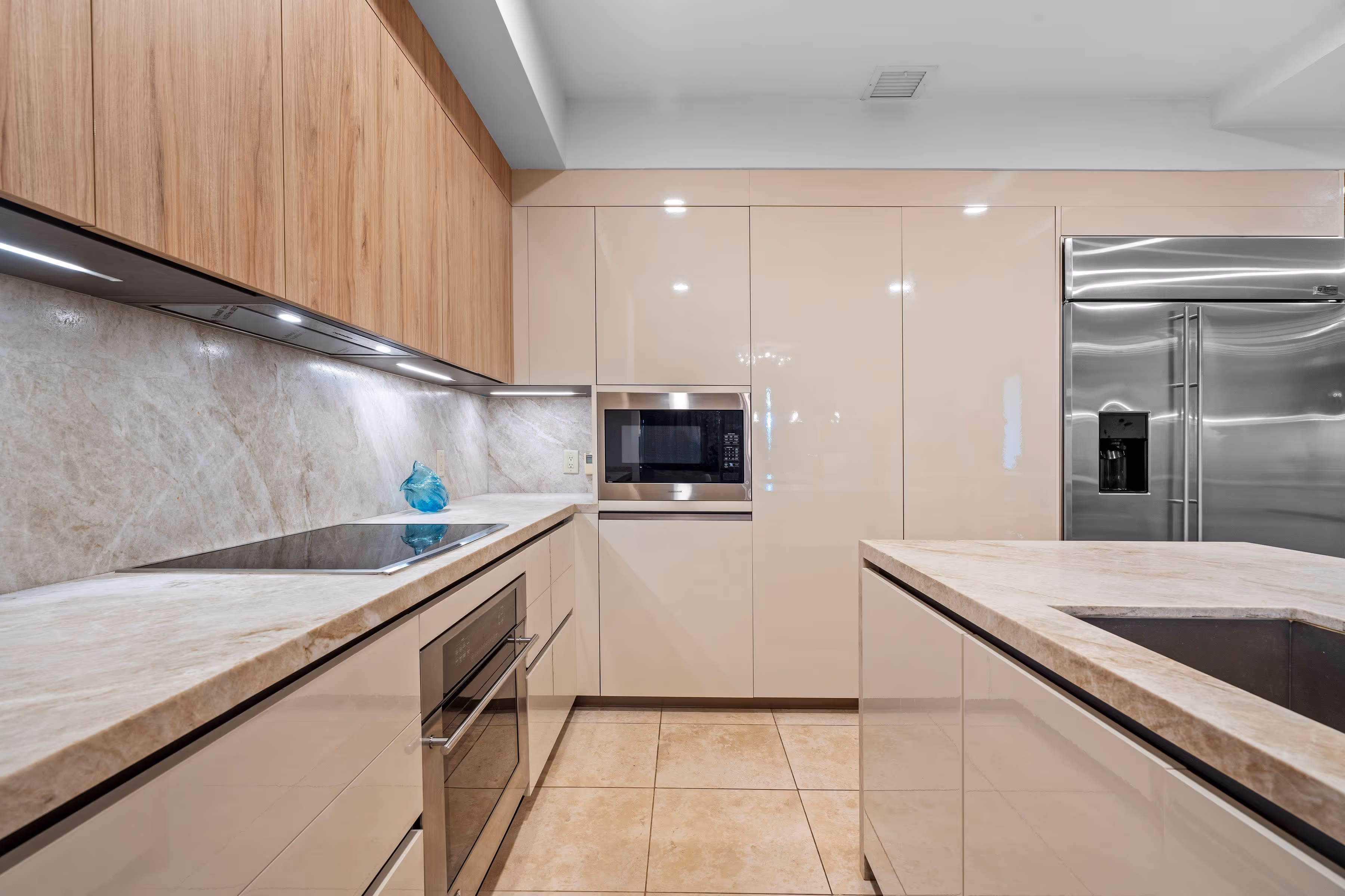 Luxury kitchen showcasing high-end cabinetry, polished marble countertops, and spacious layout at Plantation Village, Dorado Beach Resort