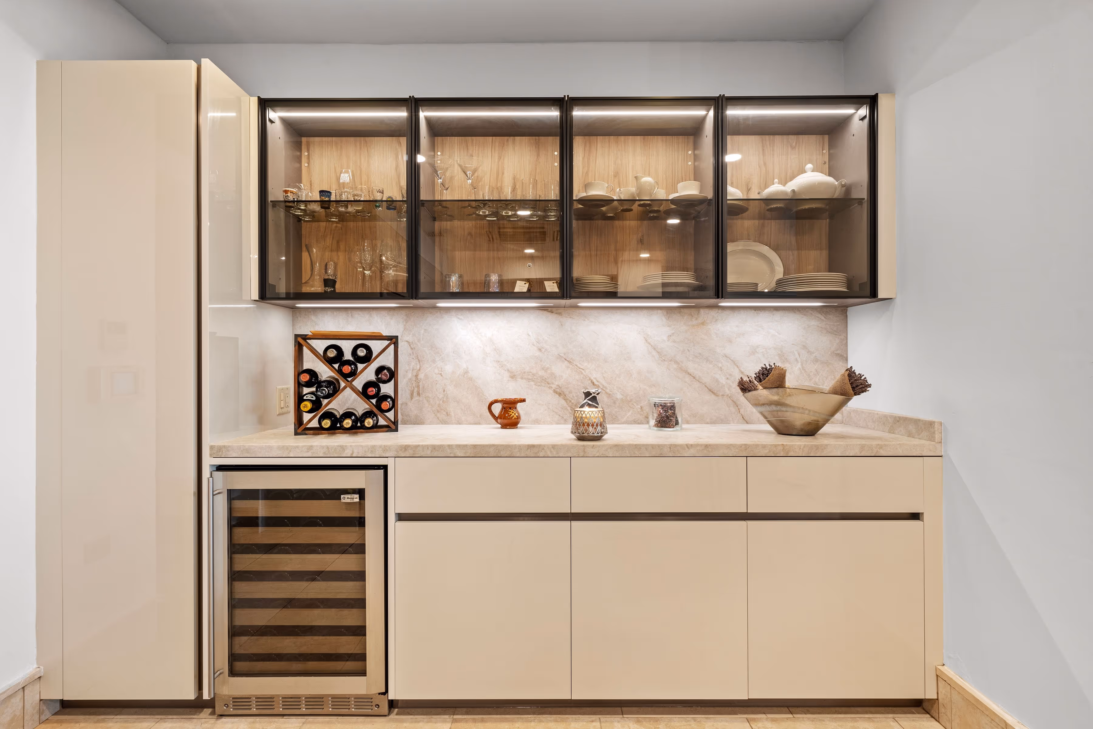 Elegant wine display and custom glass cabinetry showcasing luxury dining essentials at Plantation Village, Dorado Beach Resort