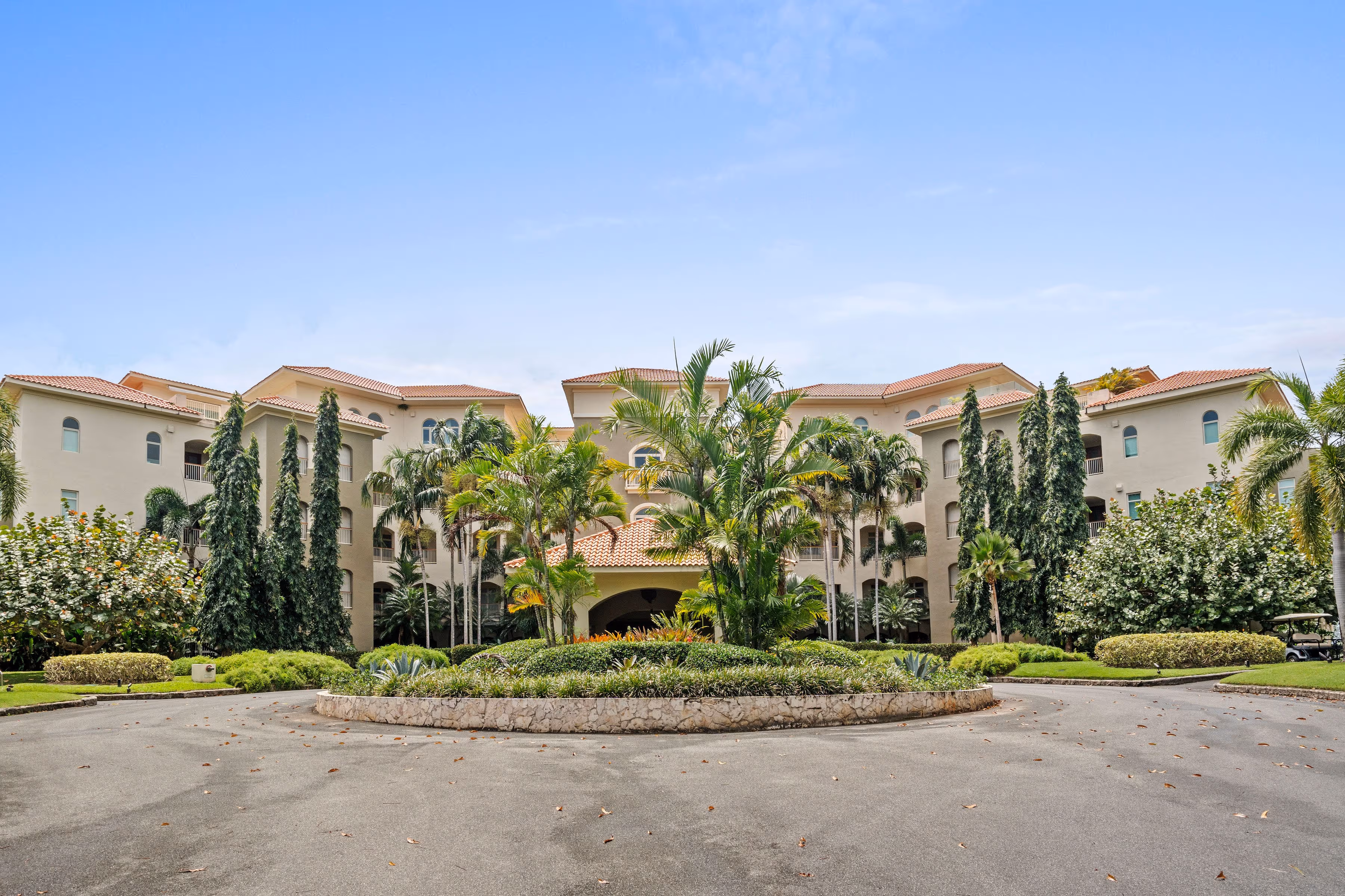 Stunning exterior view of Plantation Village building surrounded by tropical landscaping at Dorado Beach Resort