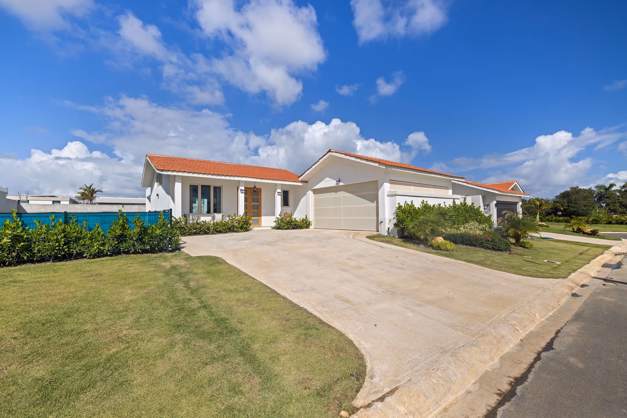 Front exterior view of luxury eco-conscious home with solar energy features in Isla de las Flores, Sabanera Dorado