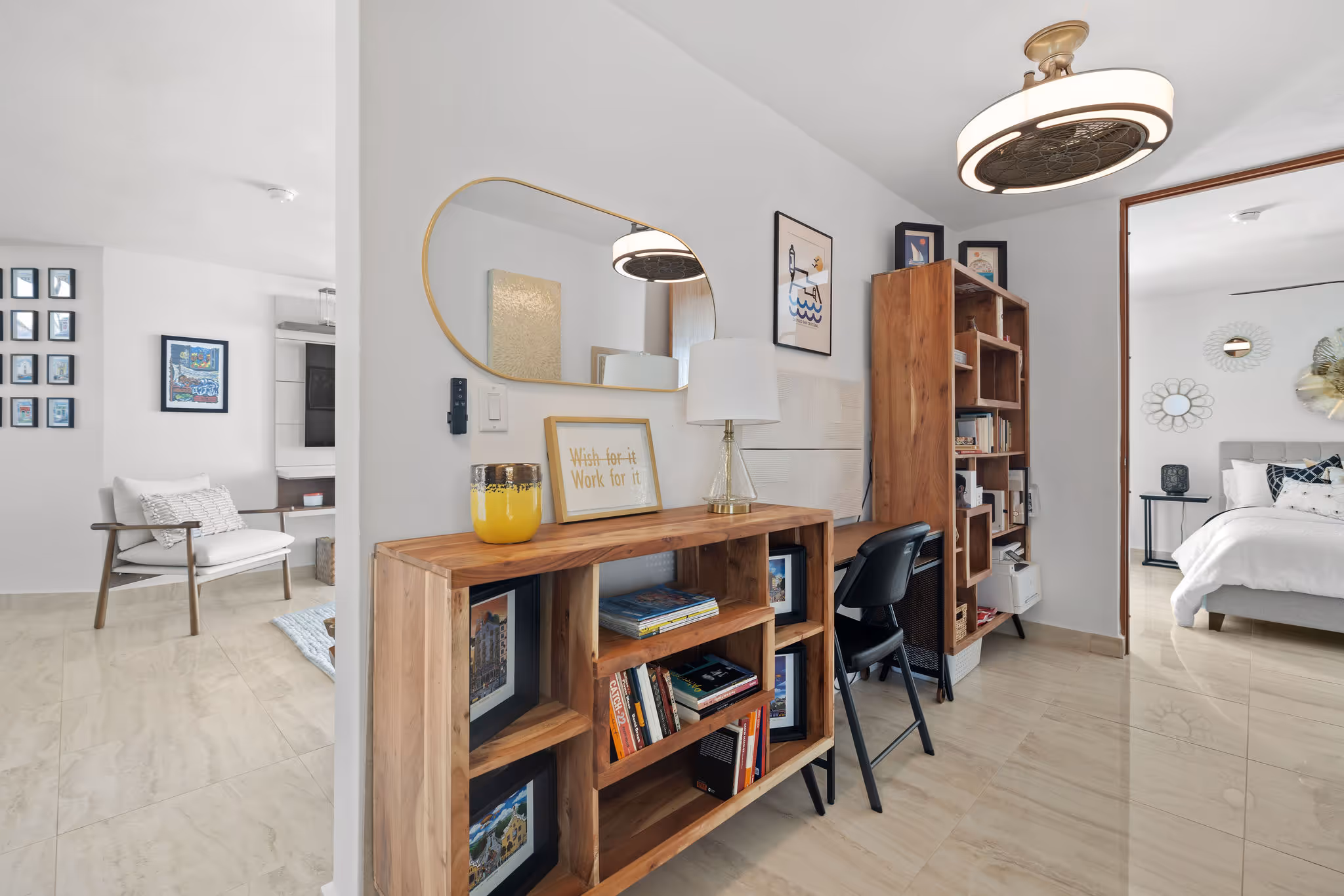 Stylish reading nook and home office space in luxury Isla de las Flores residence with custom wood shelving