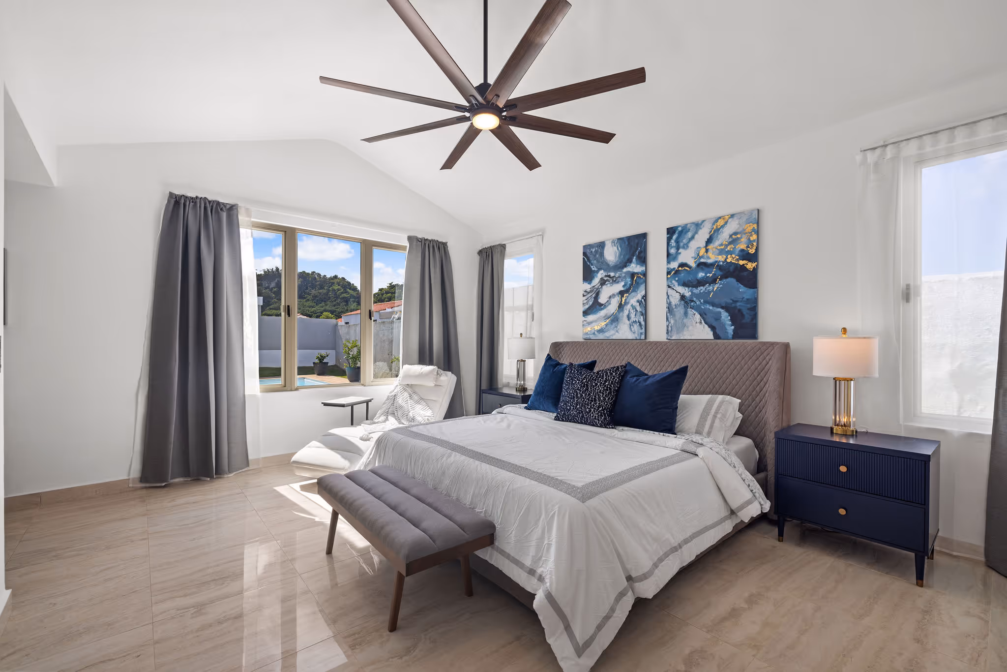 Master bedroom with vaulted ceiling and natural light in eco-luxury Isla de las Flores residence