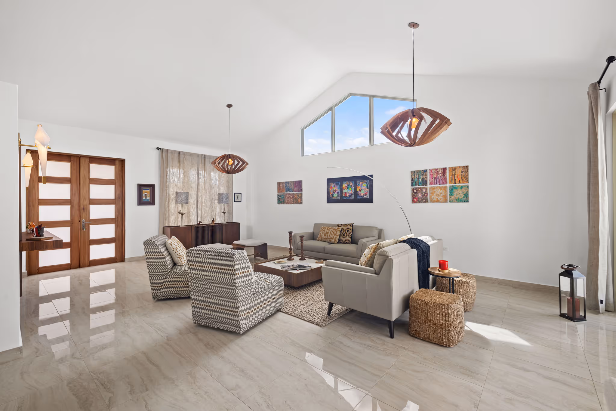 Luxurious sitting area with vaulted ceilings and natural light in eco-friendly home at Sabanera Dorado
