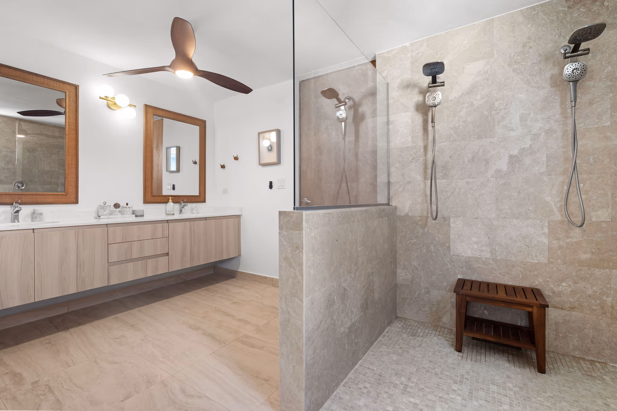 Luxury bathroom with dual rain showers, floating vanity, and marble finishes in Sabanera Dorado eco-home
