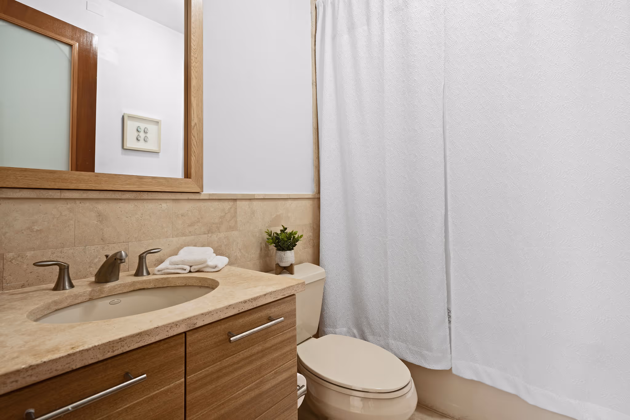 Full bathroom with modern vanity and tile finishes in Dorado Beach Resort luxury residence