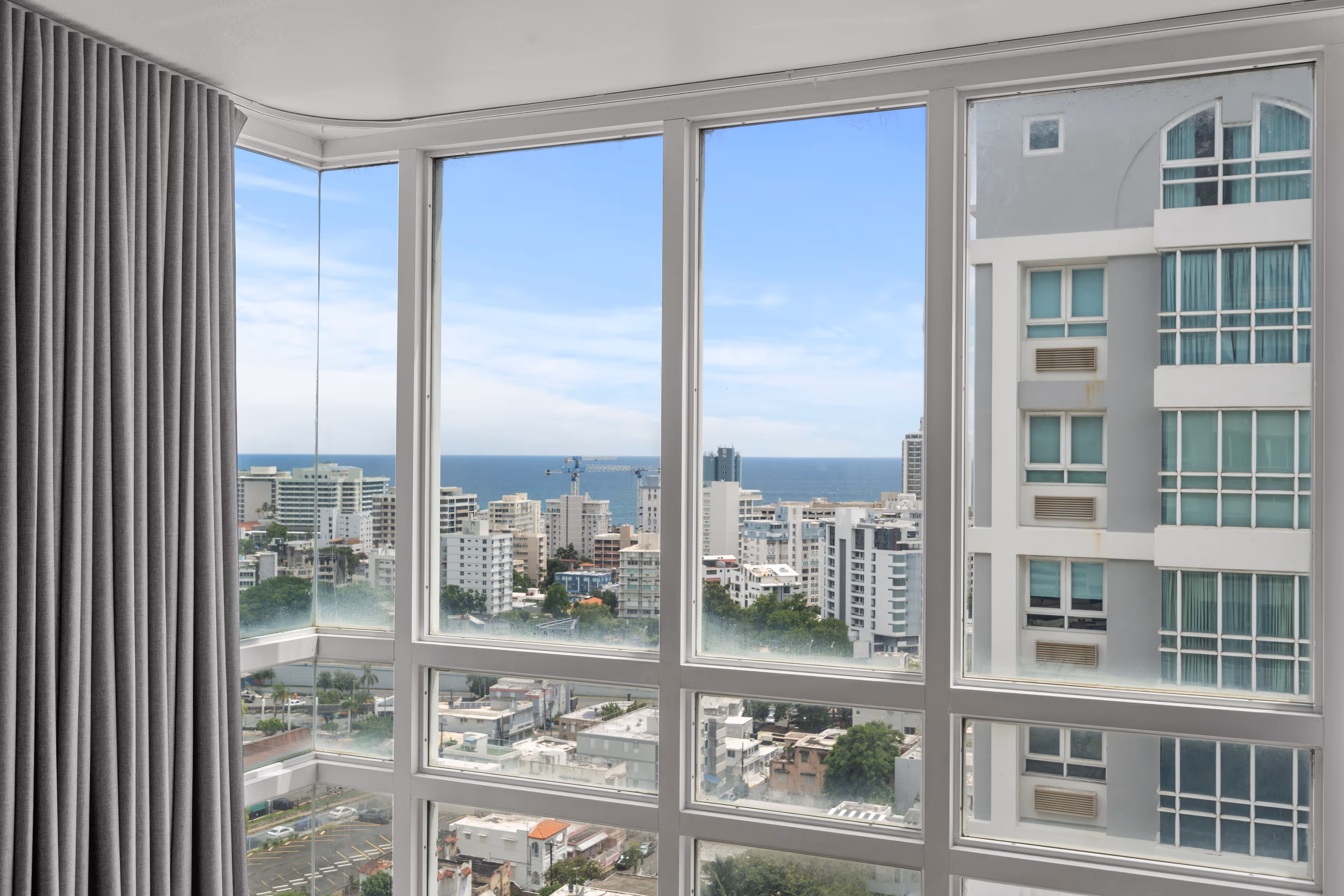 Garage parking spaces with EV chargers in luxury Santurce condo building