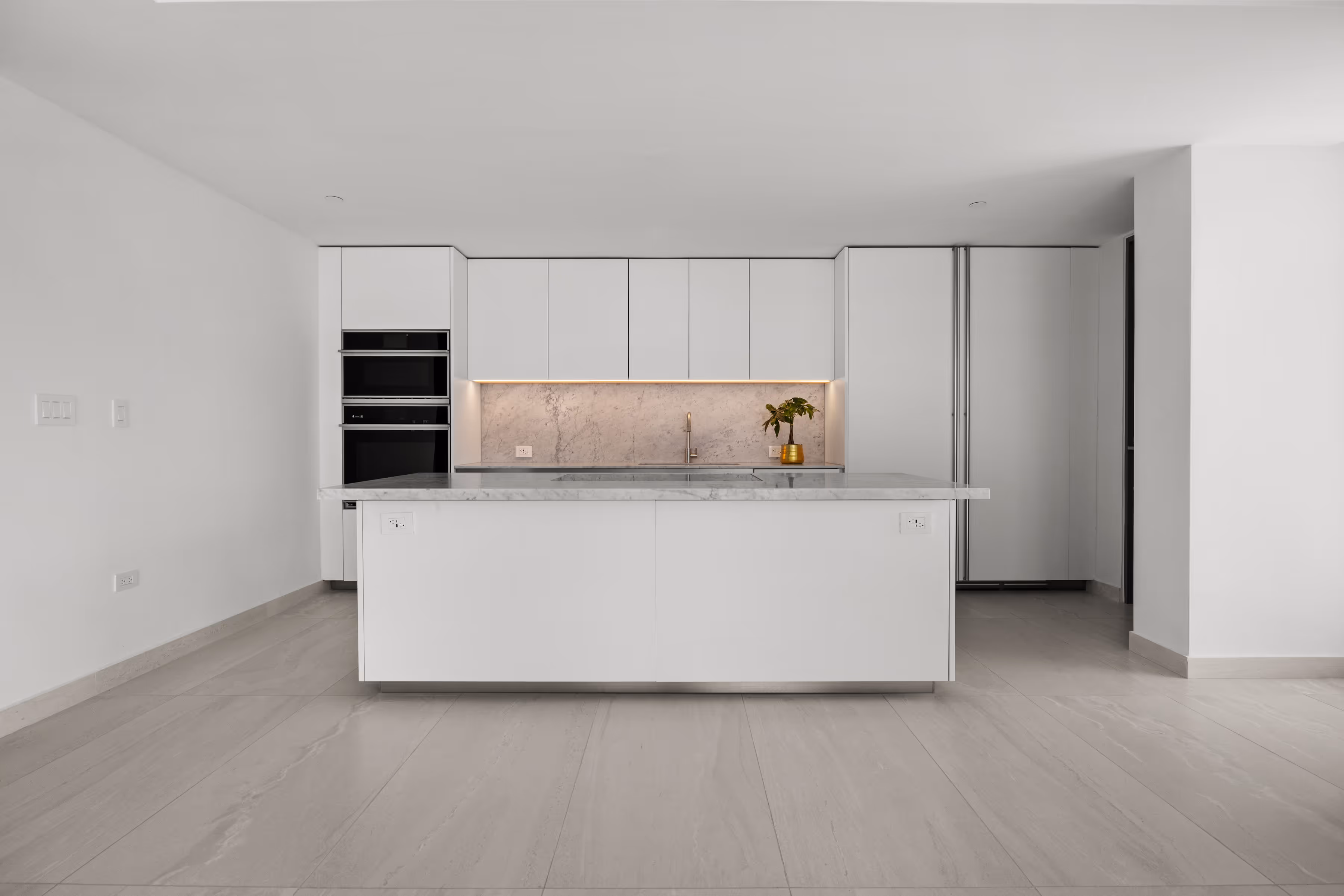 Spacious living area with floor-to-ceiling windows