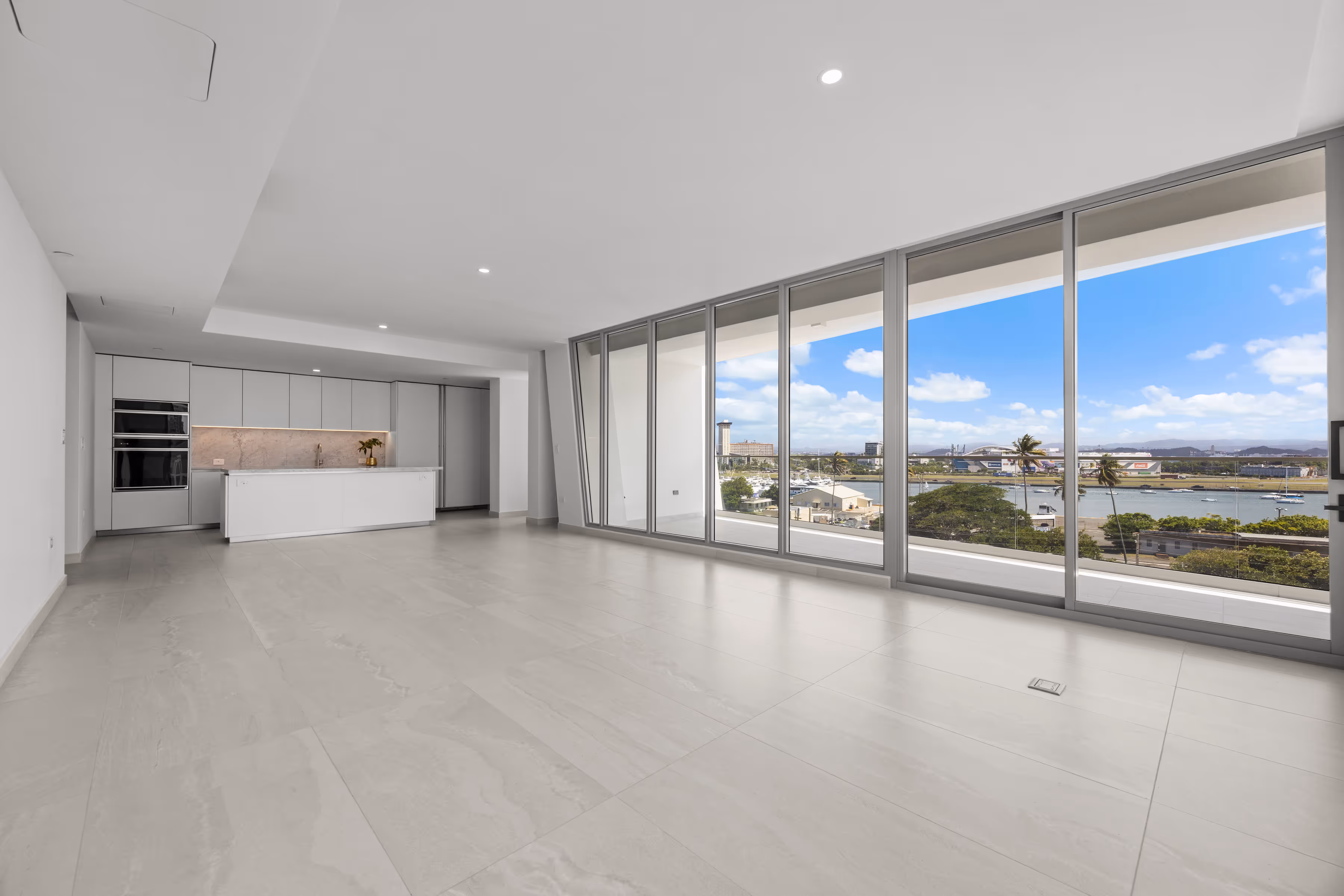 Spacious living area with floor-to-ceiling windows