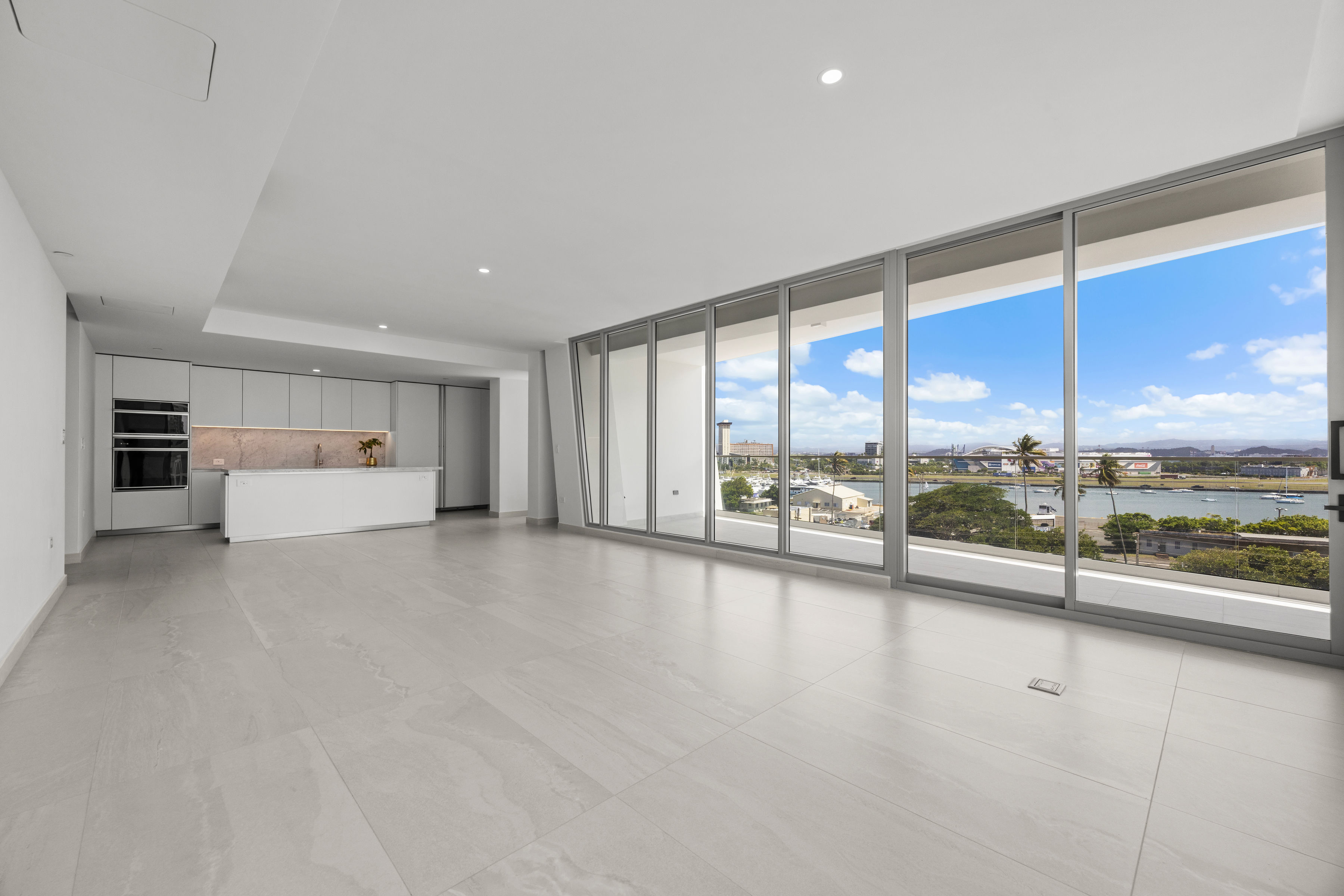 Spacious living area with floor-to-ceiling windows