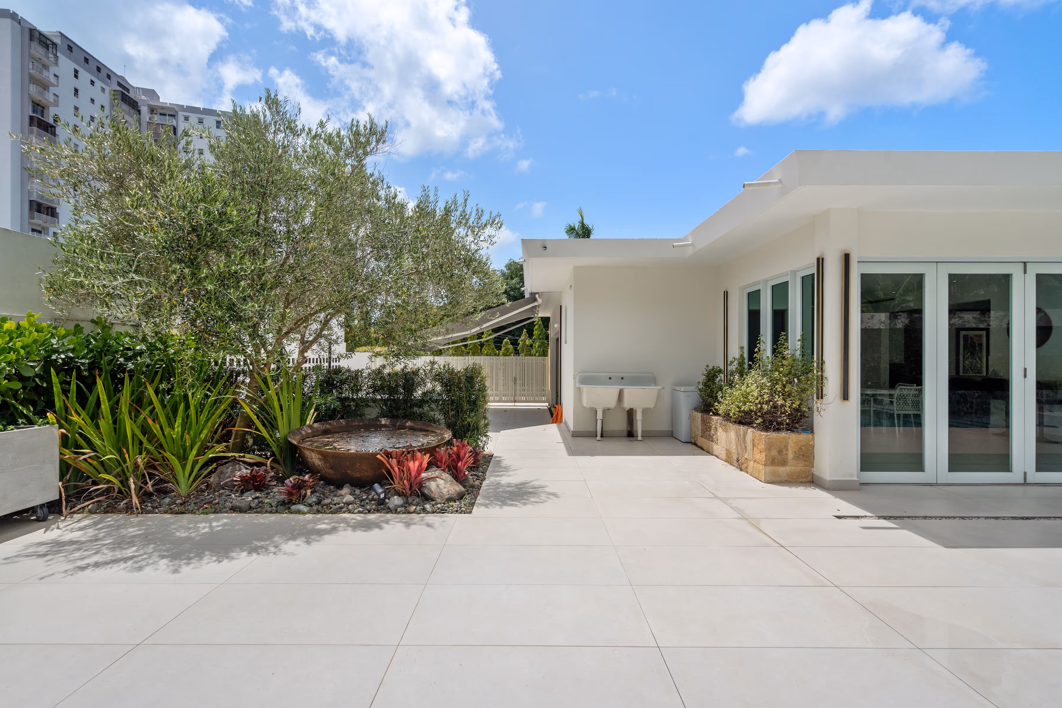 Dedicated maid’s room and three full bathrooms in elegant single-level layout