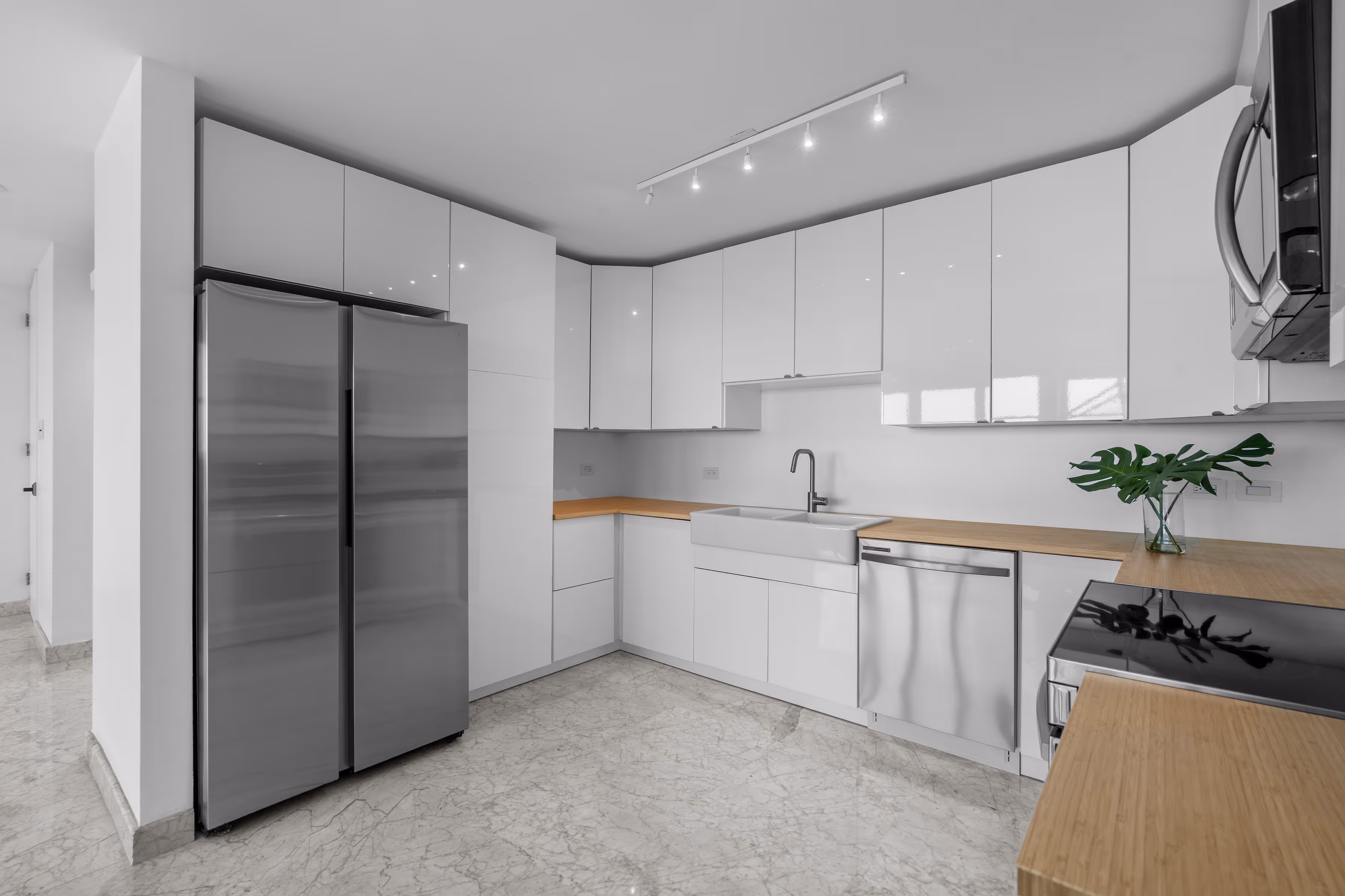 Spa-style master bathroom with jacuzzi tub and separate shower in luxury penthouse