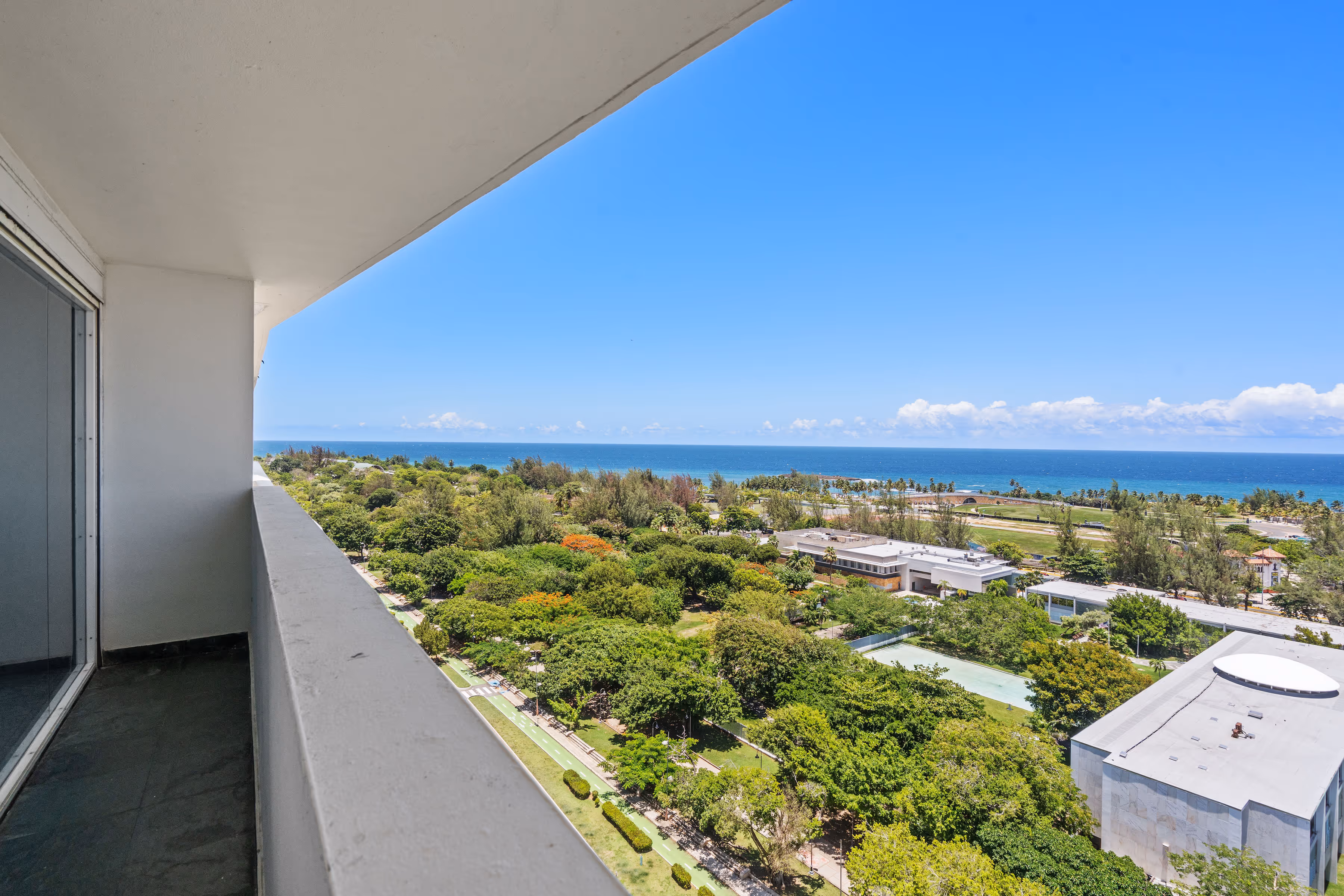 Elegant mezzanine family room with panoramic ocean views in Puerto Rico penthouse