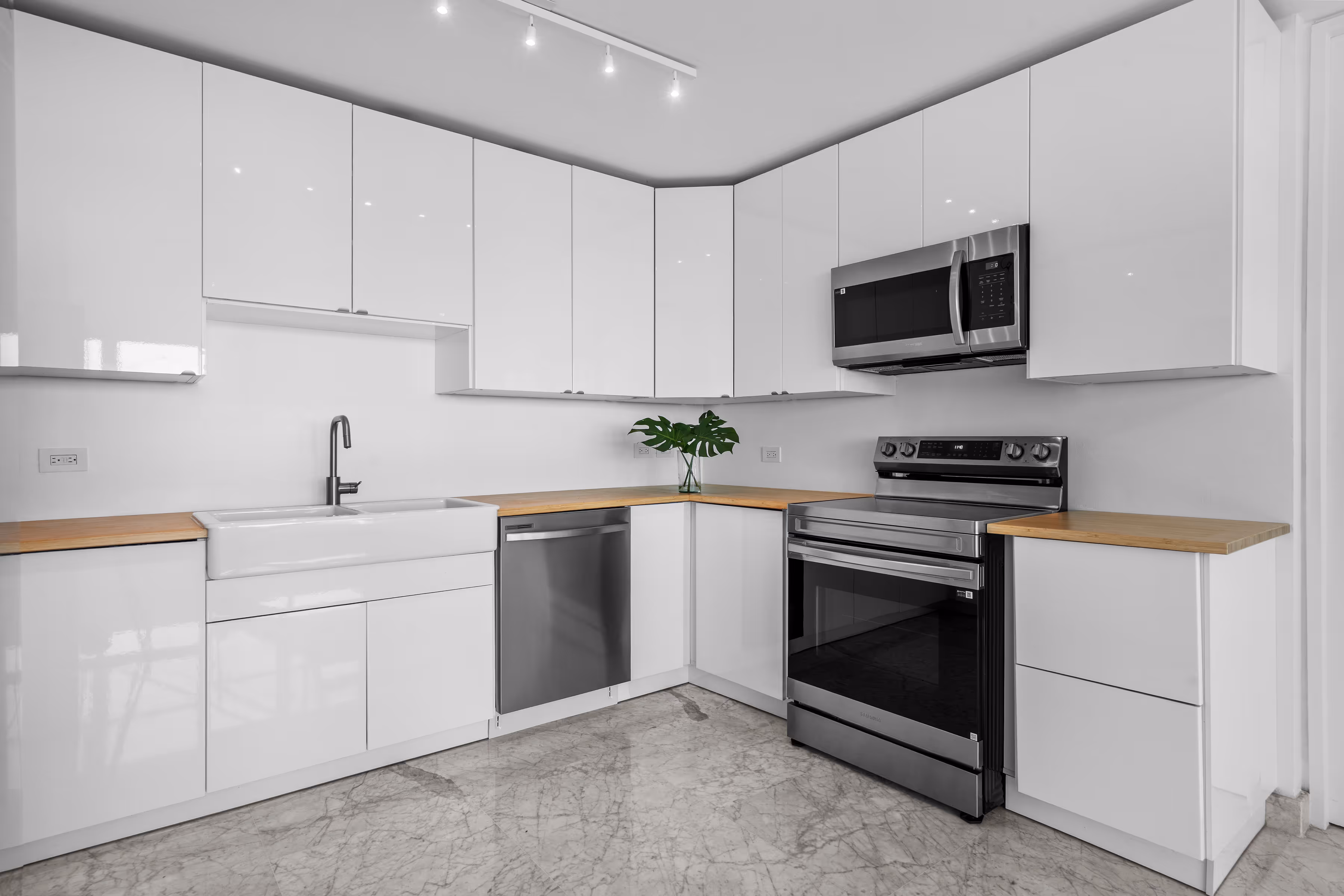 Primary suite with private balcony and storm-shuttered windows in San Juan condo