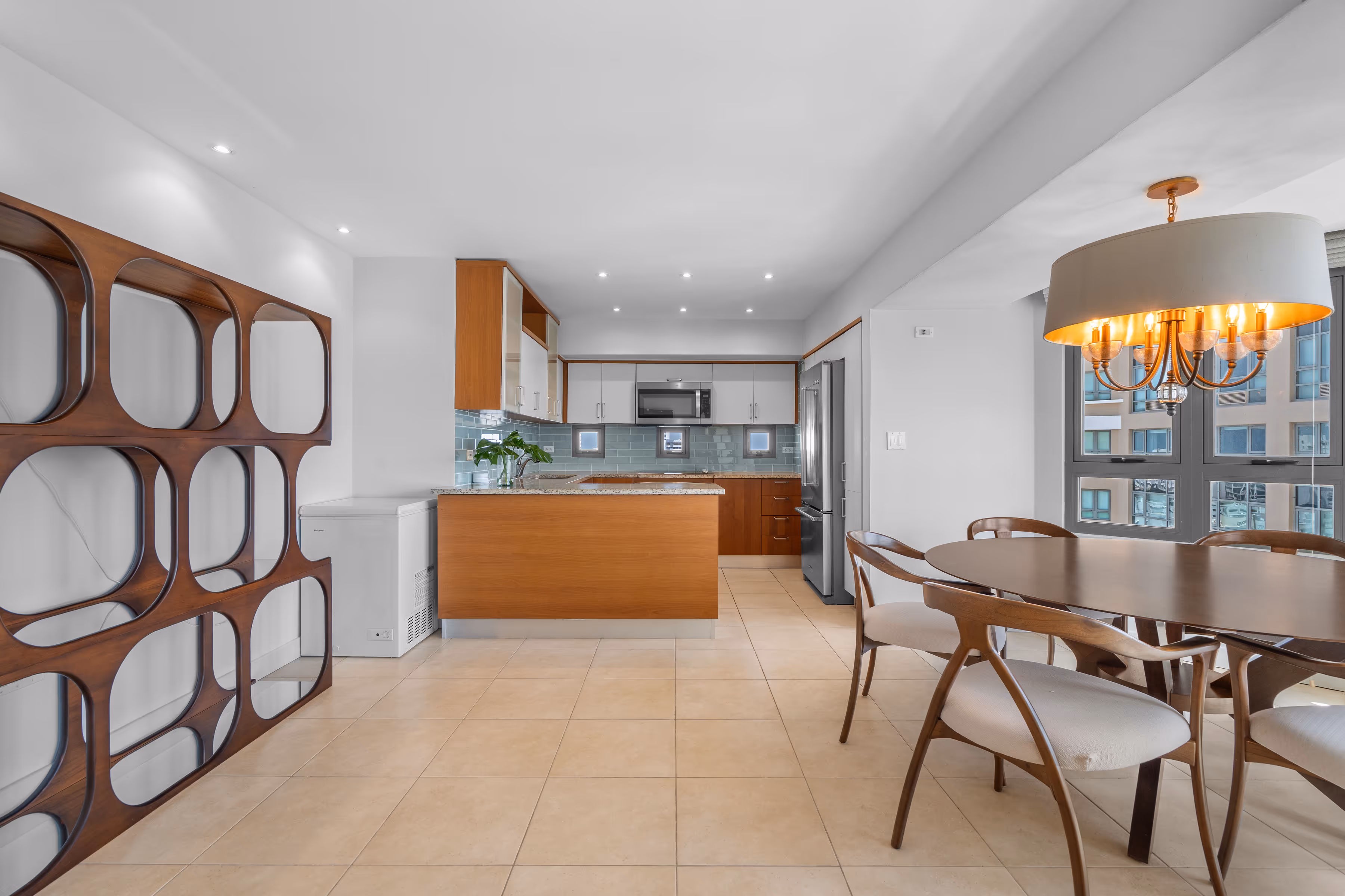 Sunset view over Condado and Atlantic Ocean from high-rise apartment balcony