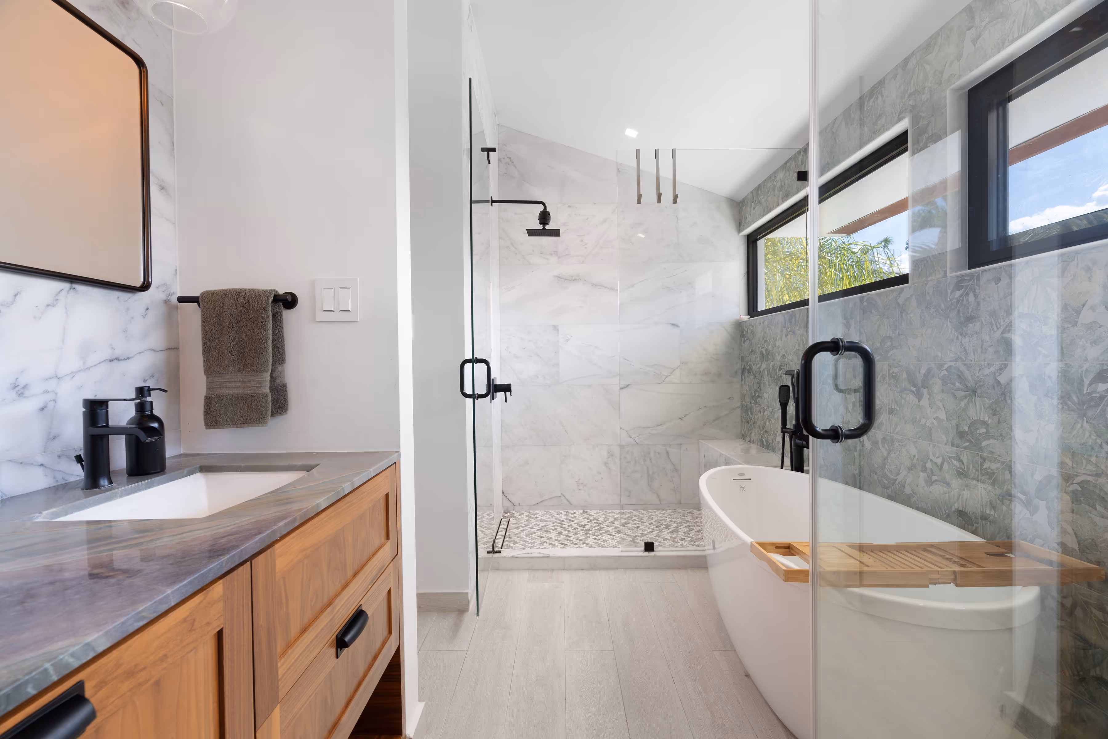 Primary bedroom suite with spa-inspired bathroom and floating tub