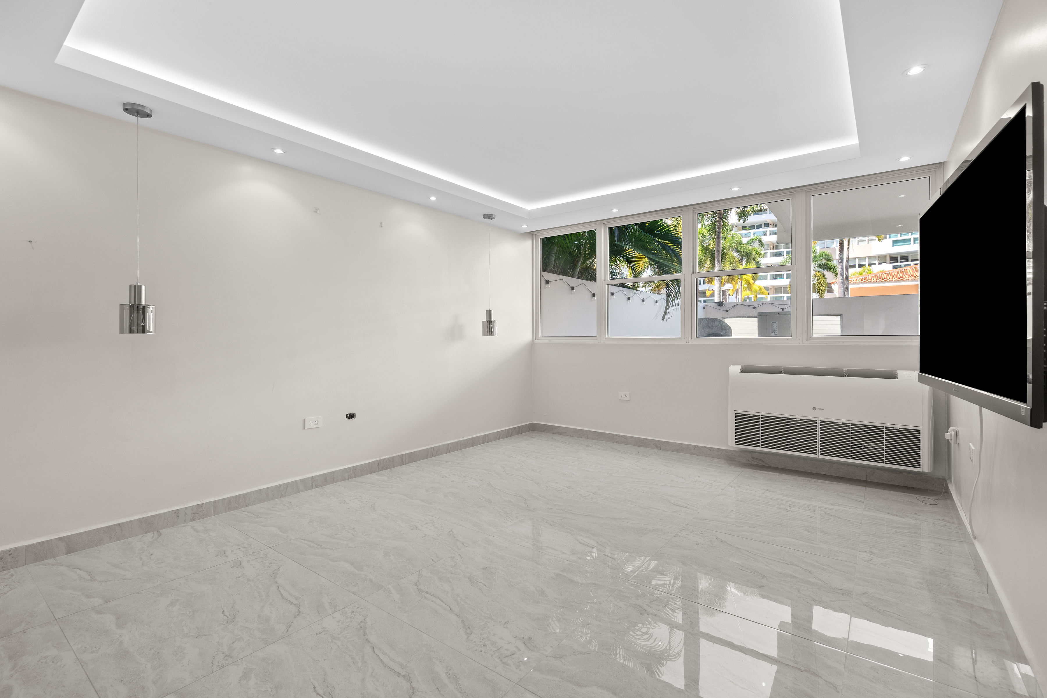 Astralis Residences spacious bedroom with large windows natural light and clean modern design