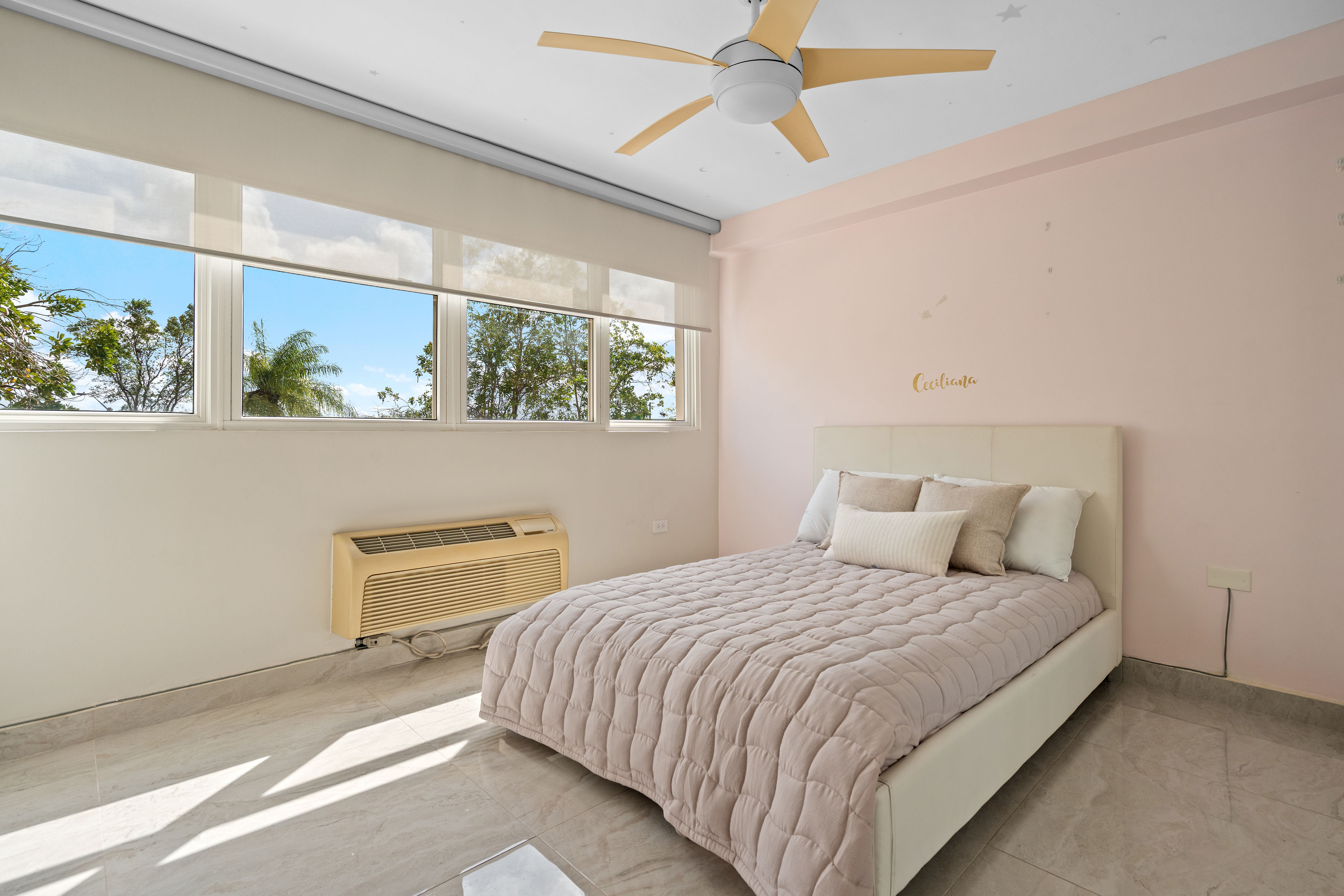 Astralis Residences bathroom with bathtub glass enclosure and modern vanity