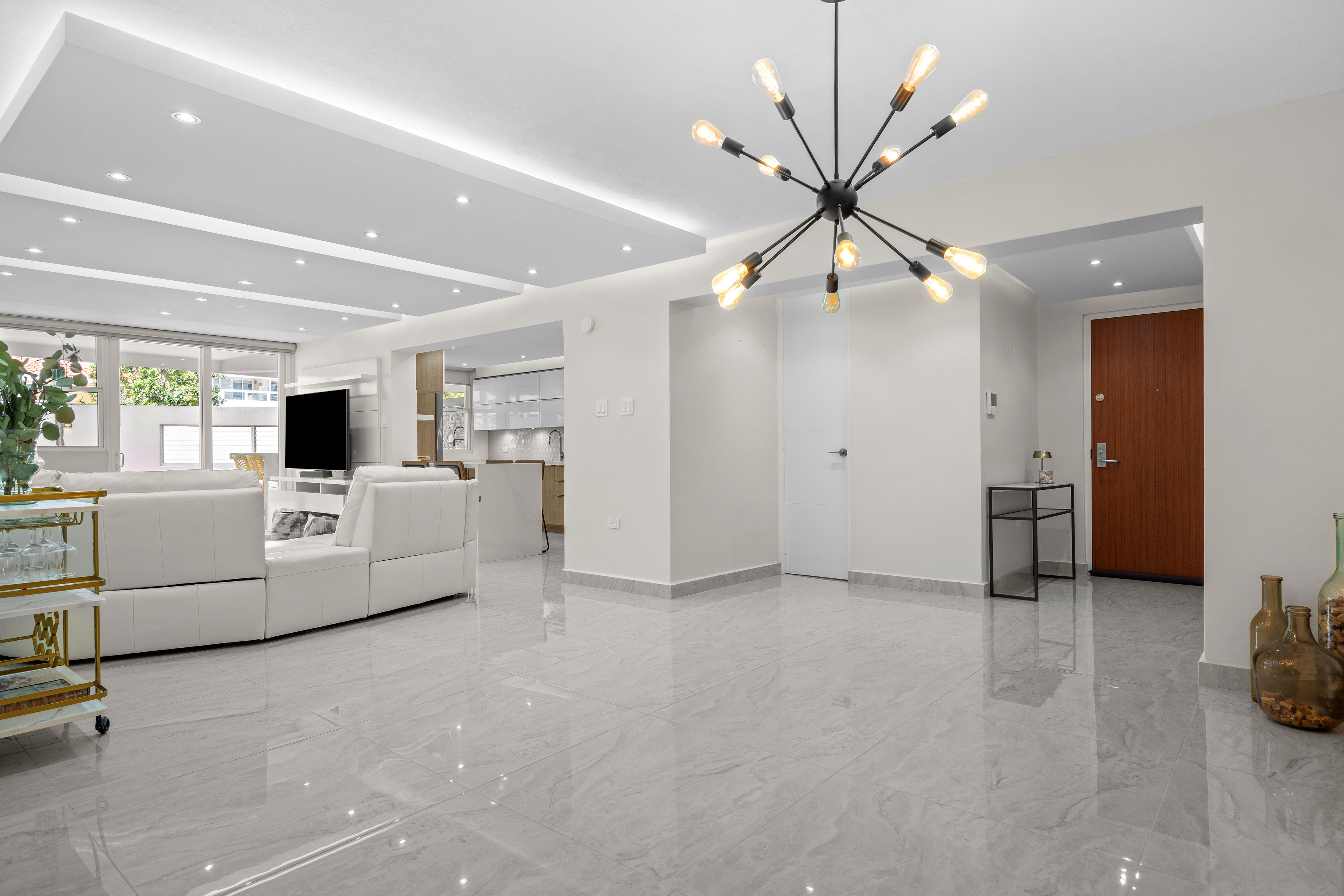 Astralis Residences open layout living and dining area with contemporary lighting
