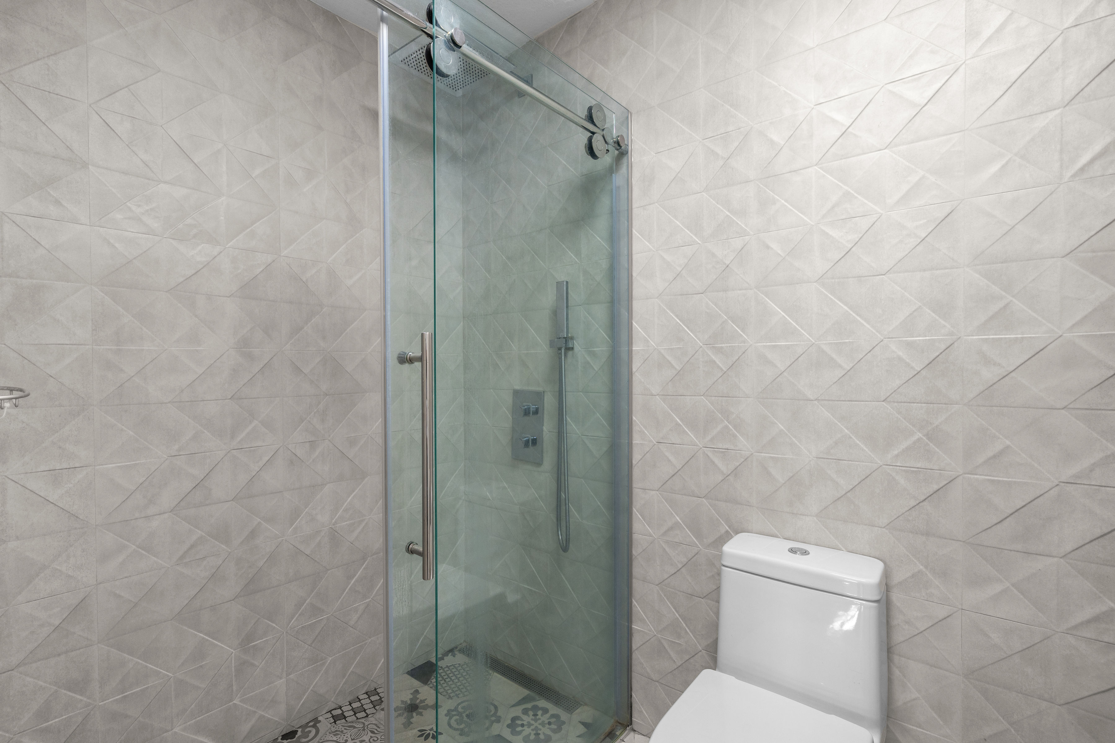 Astralis Residences walk-in closet with custom shelving and storage system