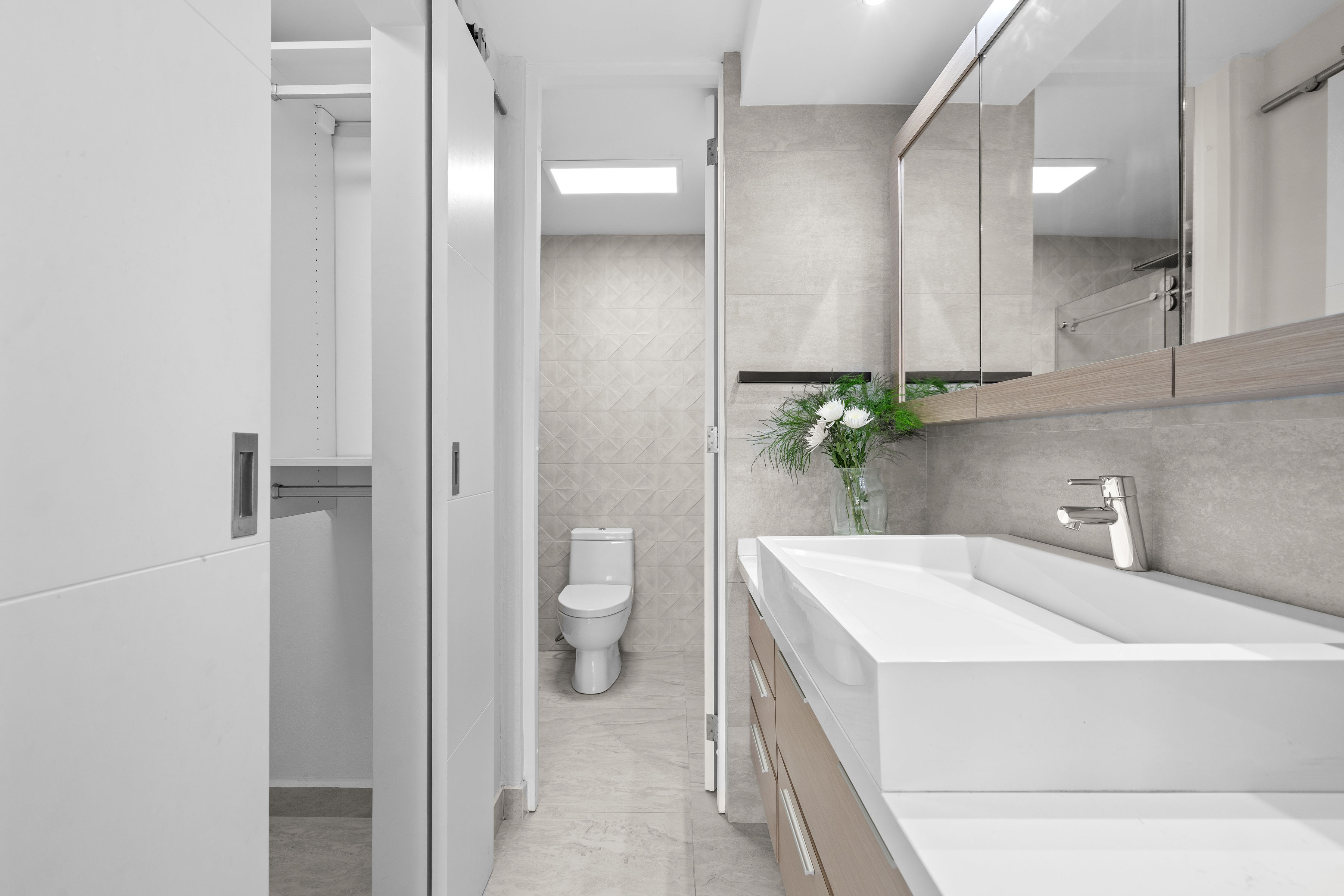 Astralis Isla Verde bathroom with glass shower modern tile and sleek fixtures