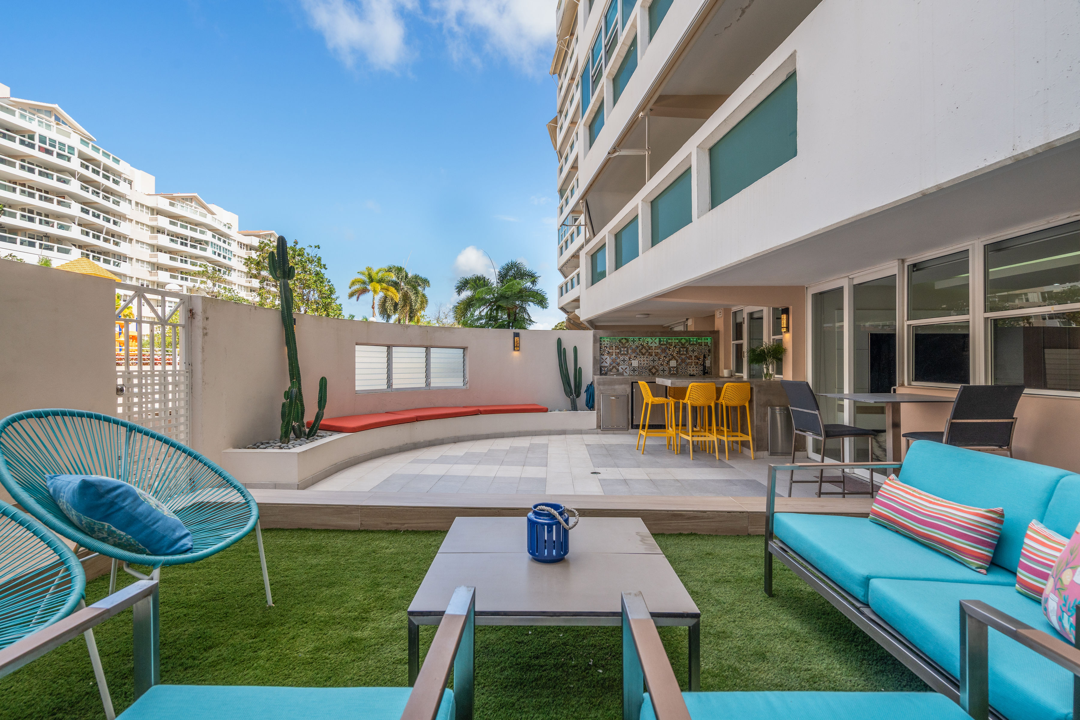 Astralis Isla Verde private terrace with outdoor kitchen BBQ bar seating and lounge area