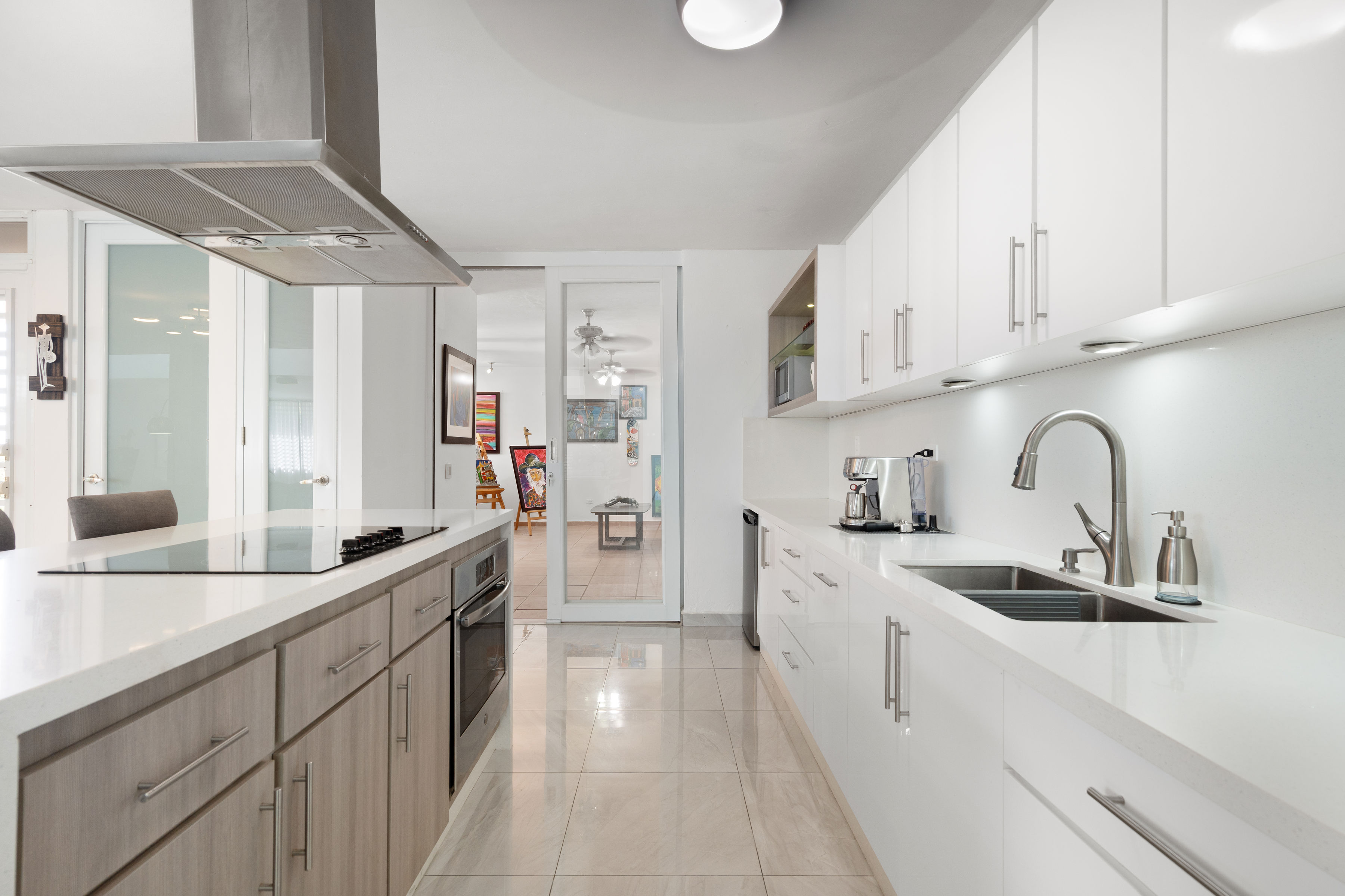 Bright kitchen with long counter space and modern finishes in San Juan Puerto Rico home