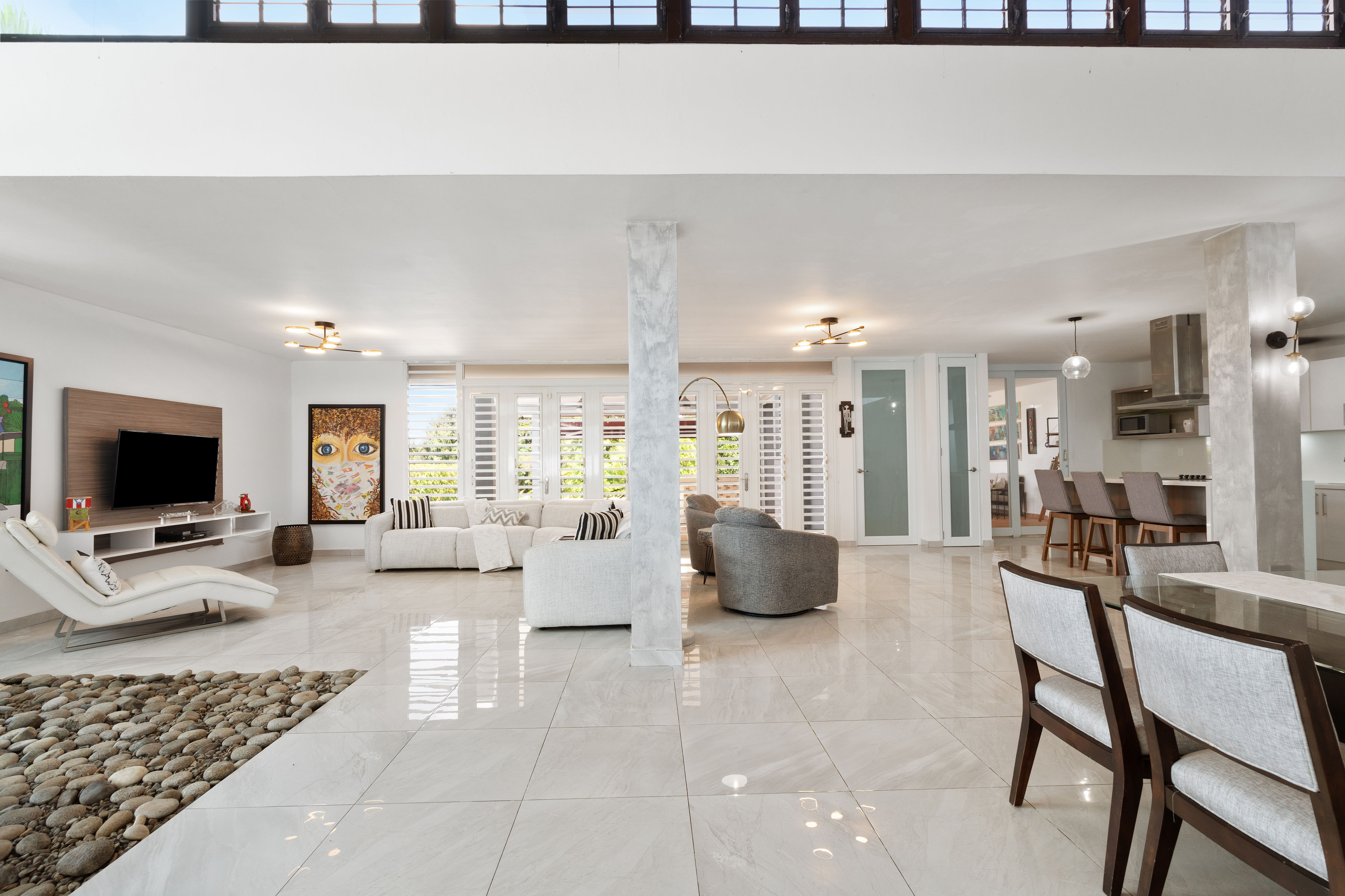 Spacious open layout with living, dining and kitchen areas connected in Mansiones de Villanova residence