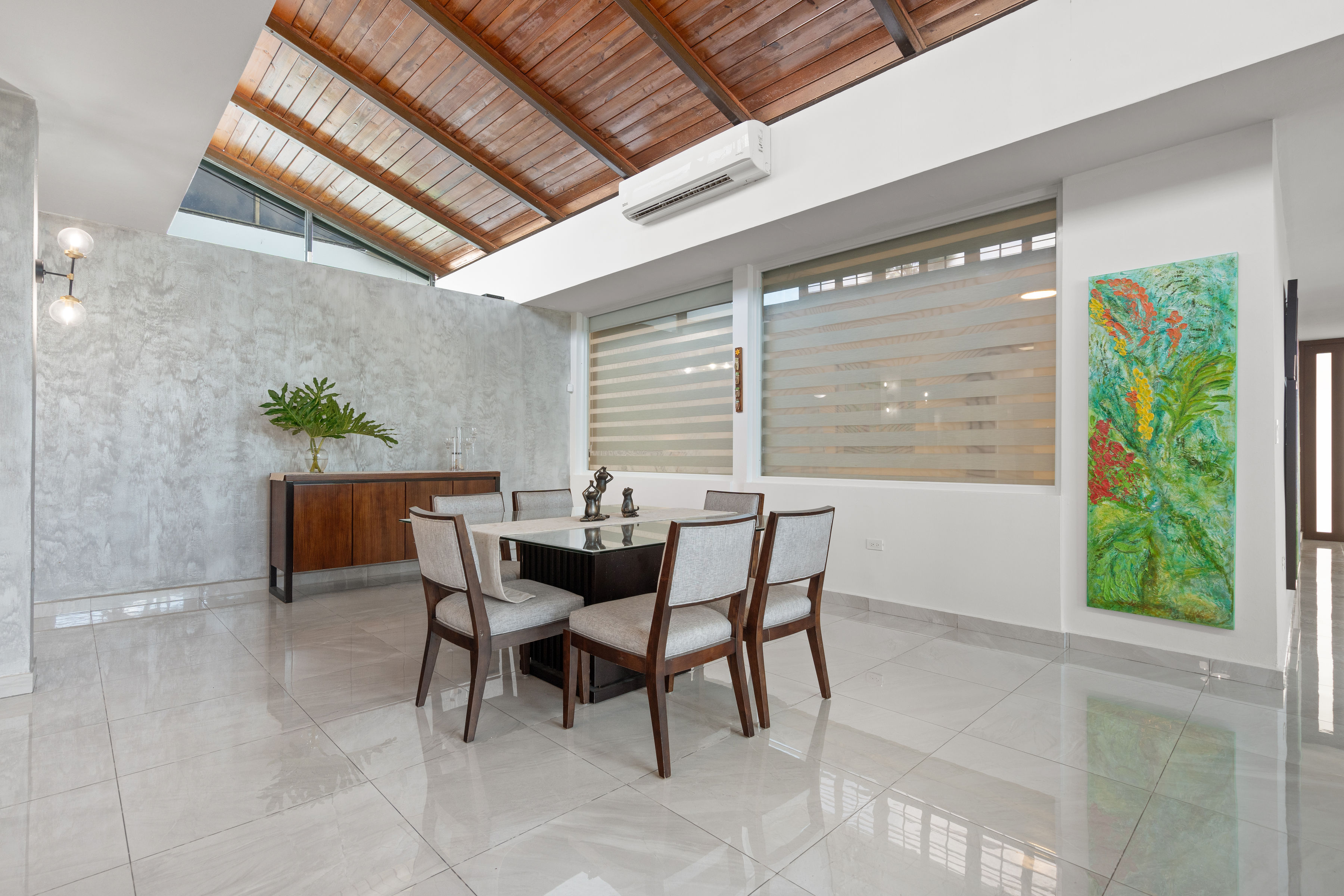 Dining area with wood ceiling and natural light in Mansiones de Villanova San Juan property