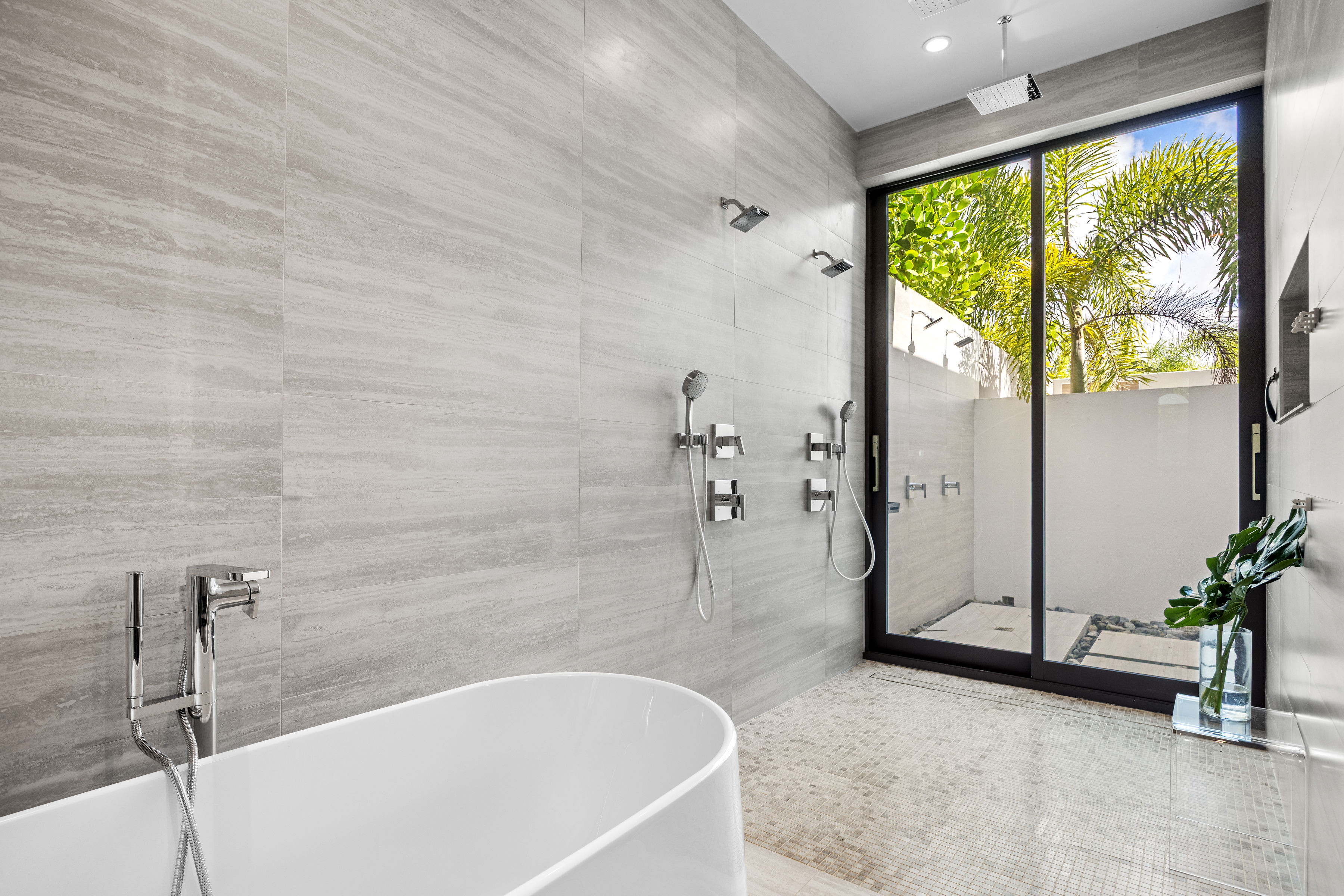 Dorado Beach Resort The Isles residence bathroom with outdoor shower access and garden views