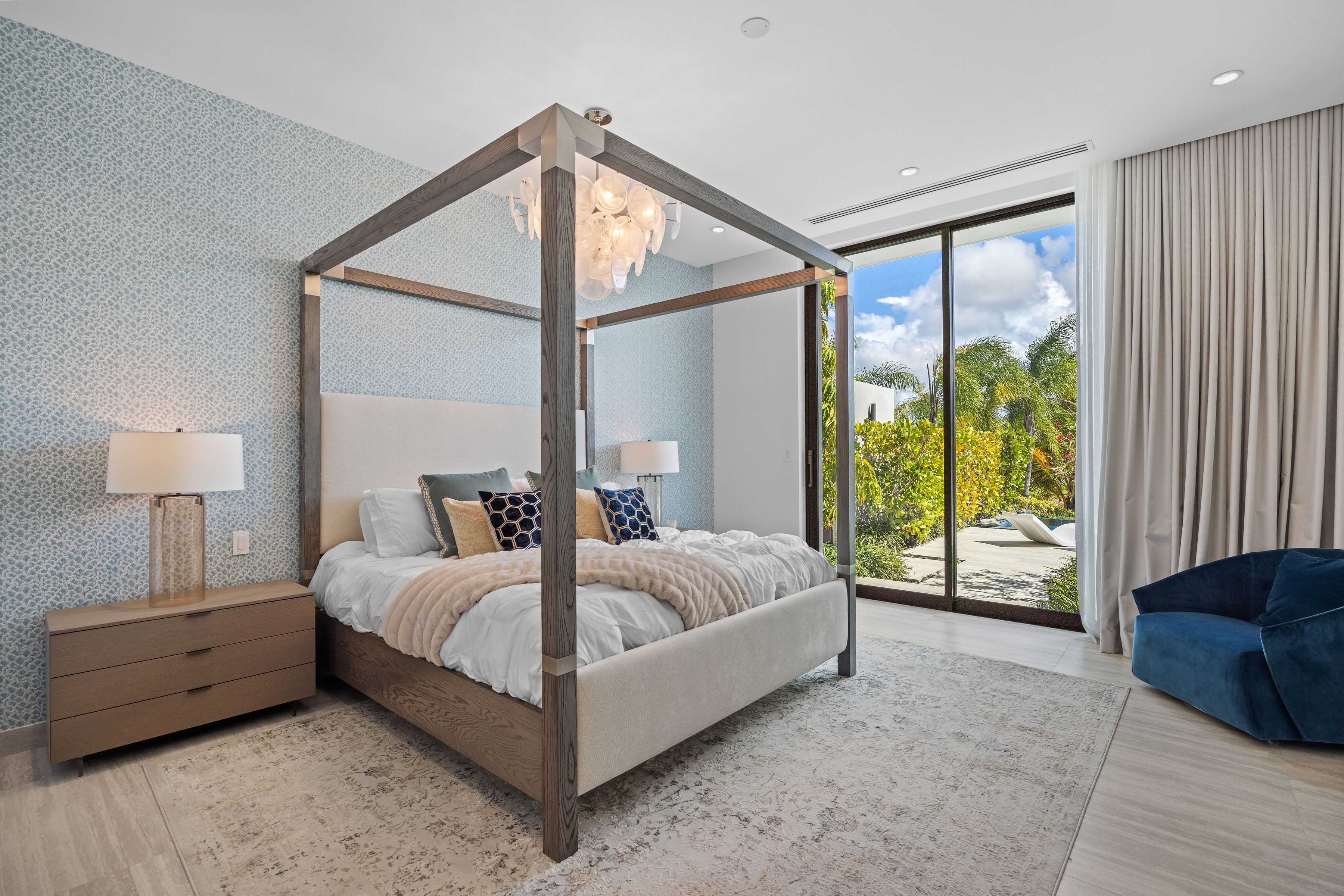 Dorado Beach Resort The Isles residence primary bedroom with canopy bed and direct pool access