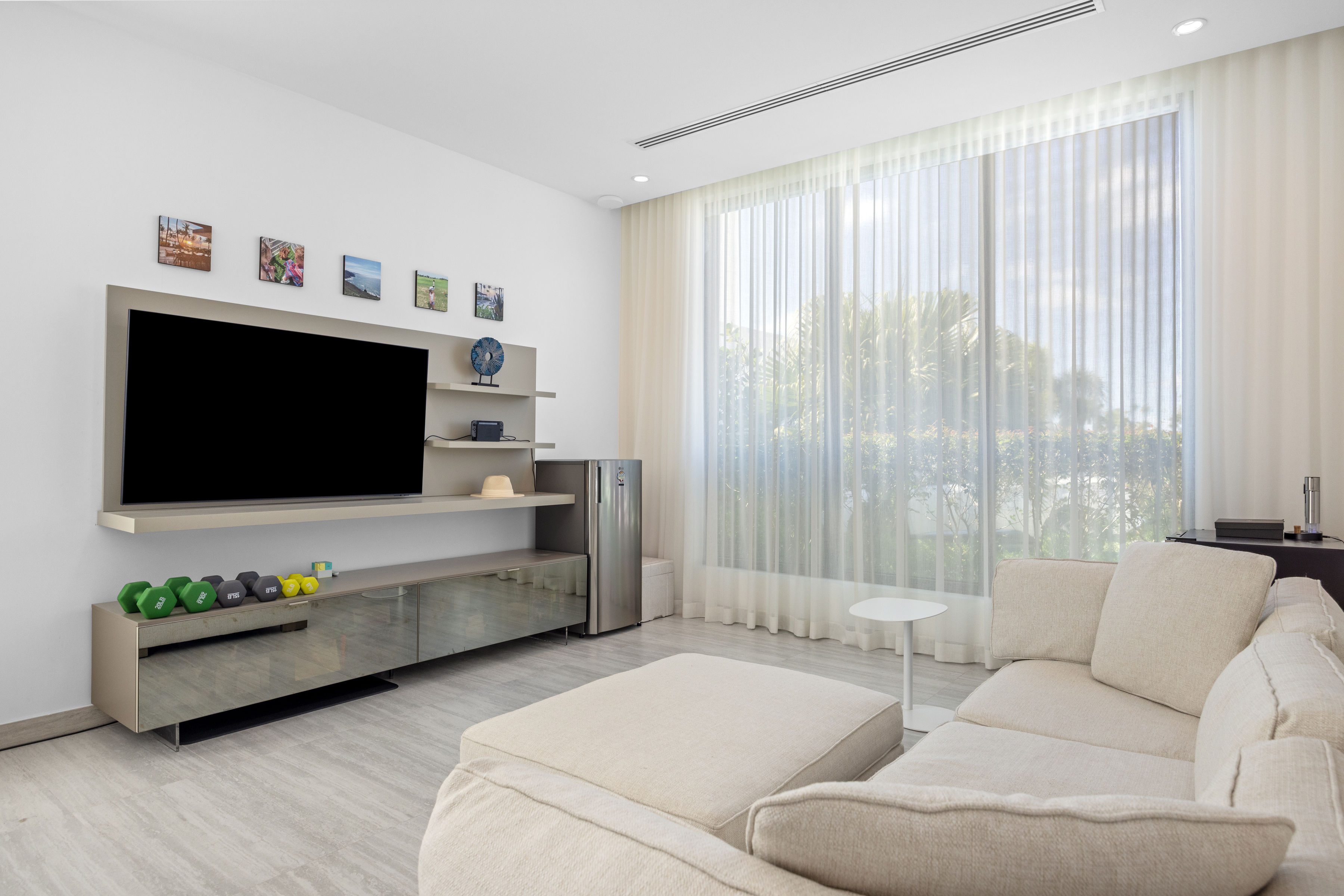 Dorado Beach Resort The Isles residence secondary family room with large window and lounge seating