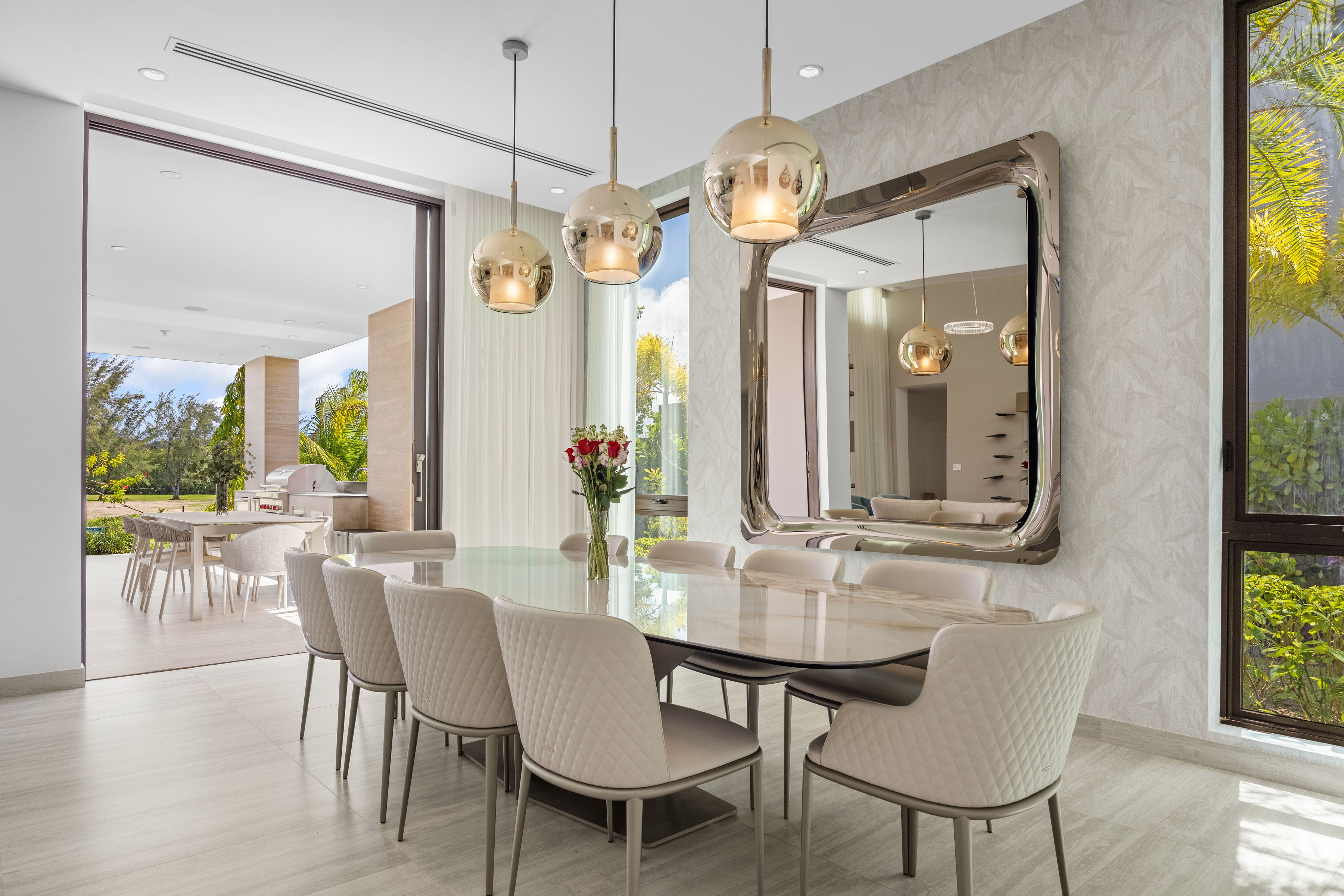 Dorado Beach Resort The Isles residence formal dining area with designer lighting and terrace access